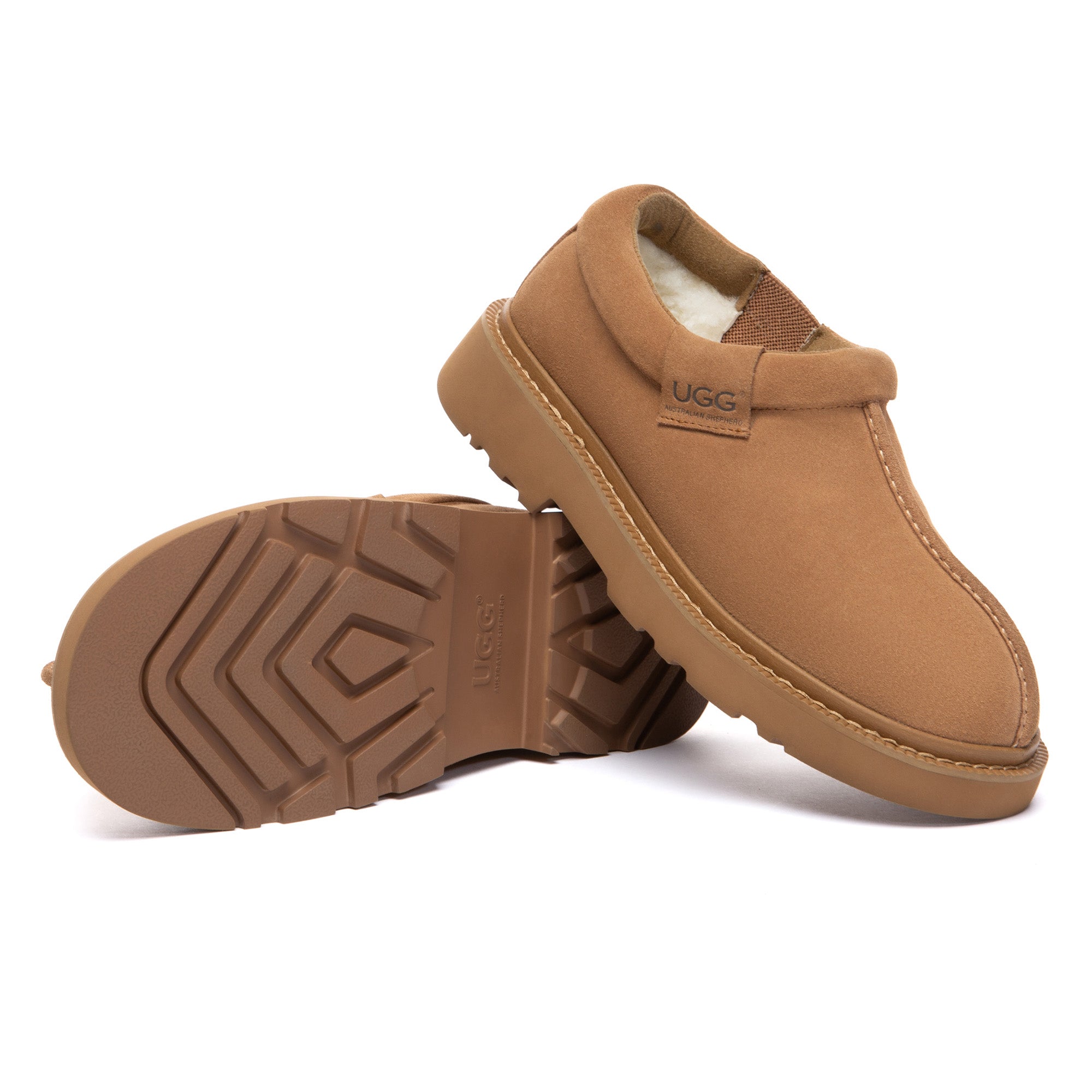 EverUgg Axton ankle UGG slippers with plush lining and soft suede exterior on a neutral-colored surface.