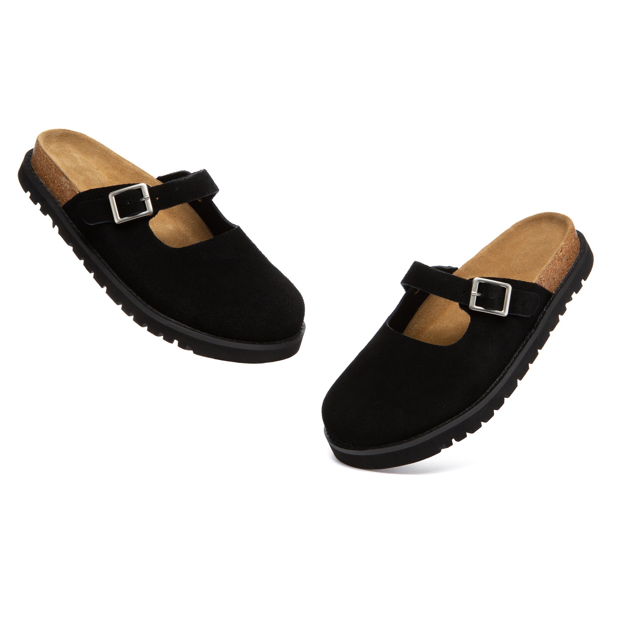 EverUgg Birkie Buckle Strap Slides slippers with wide straps and buckle detail, laid on a wooden surface.