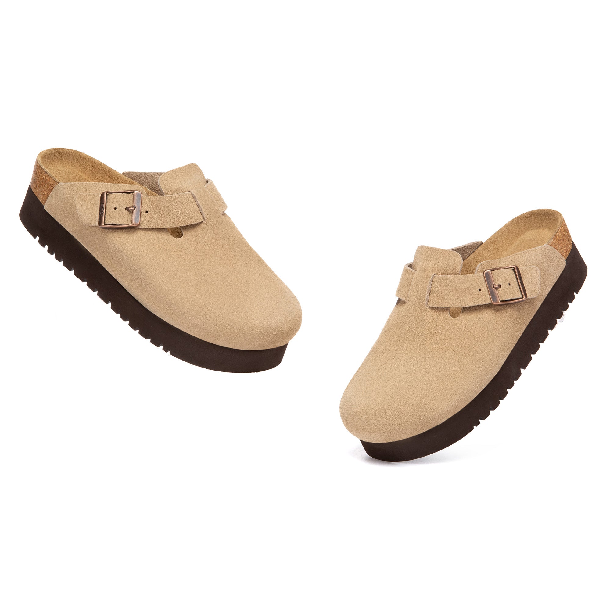 EverUgg Birkie Suede Buckle Platform Clogs slippers with buckle detail and platform sole, shown in a cozy indoor setting.