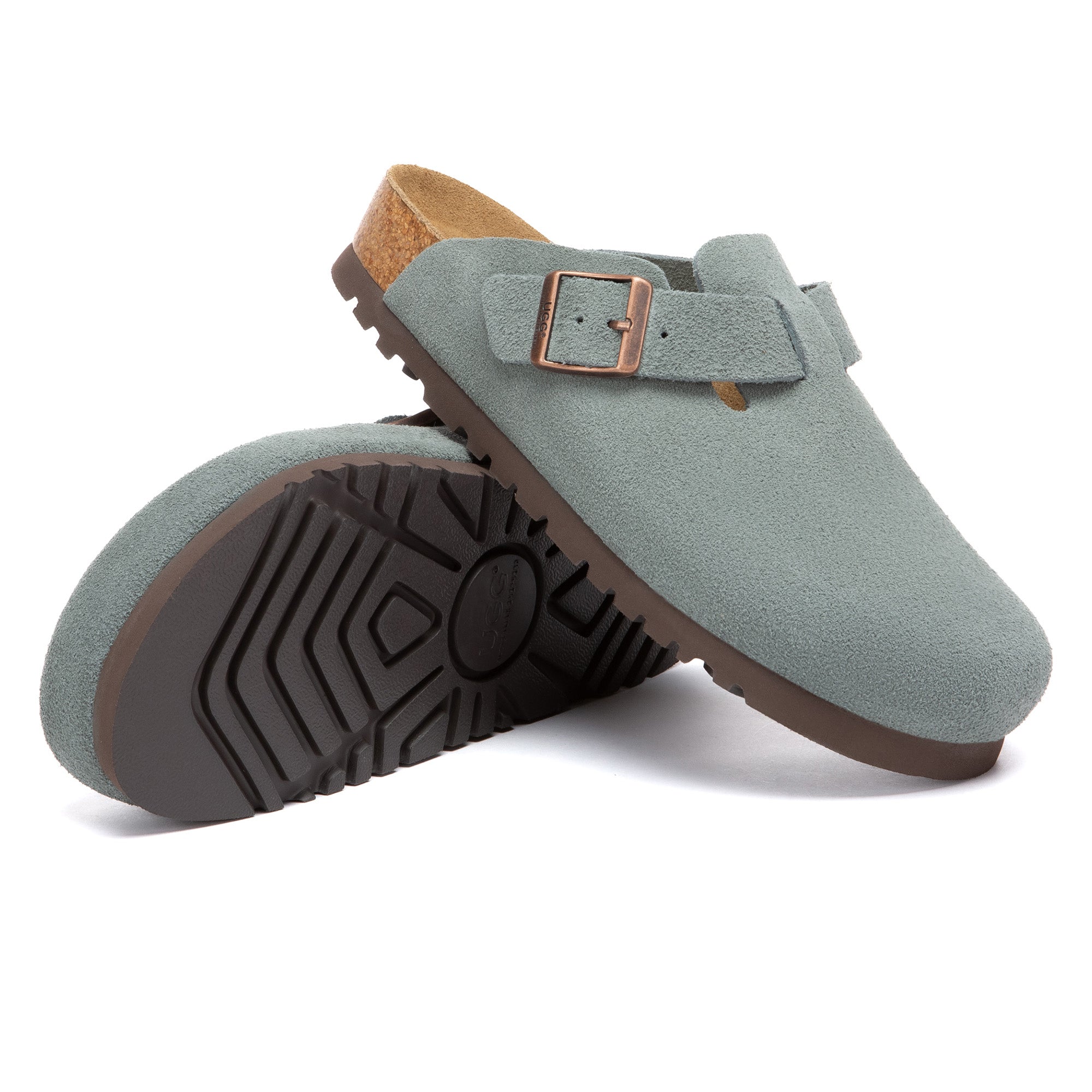 EverUgg Birkie Suede Buckle Clogs slippers with buckle details and suede texture, shown in a cozy indoor setting.