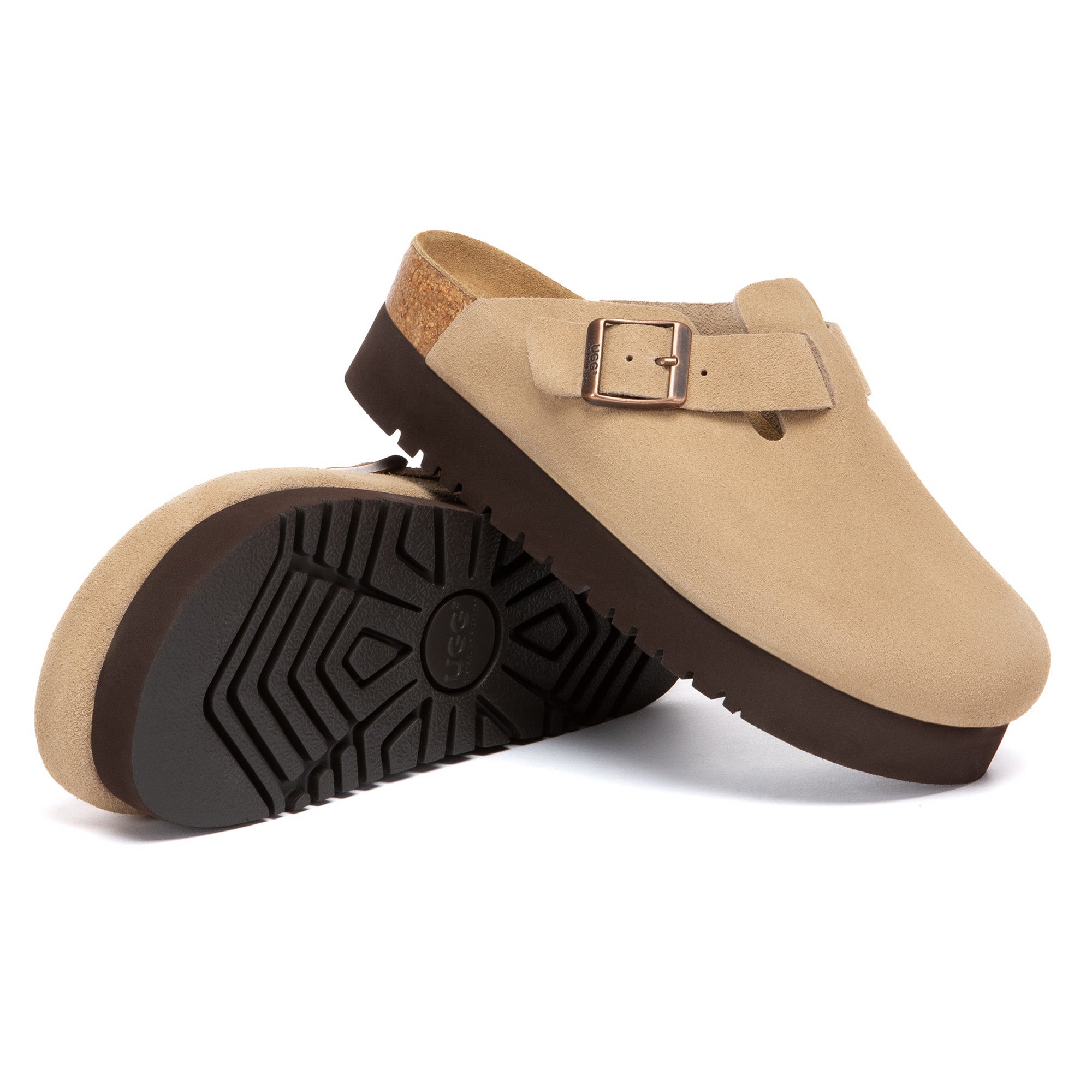 EverUgg Birkie Suede Buckle Platform Clogs slippers with buckle detail and platform sole, shown in a cozy indoor setting.