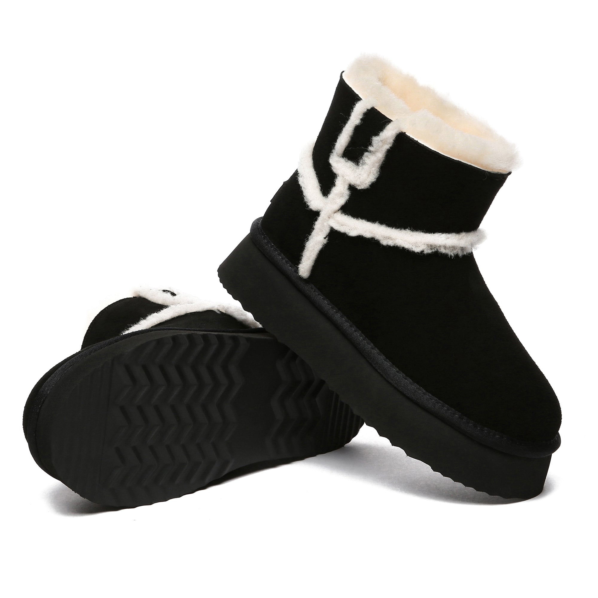 Black EverUgg Bronte women’s platform UGG boots with cozy sheepskin lining and chunky soles, shown from side view.