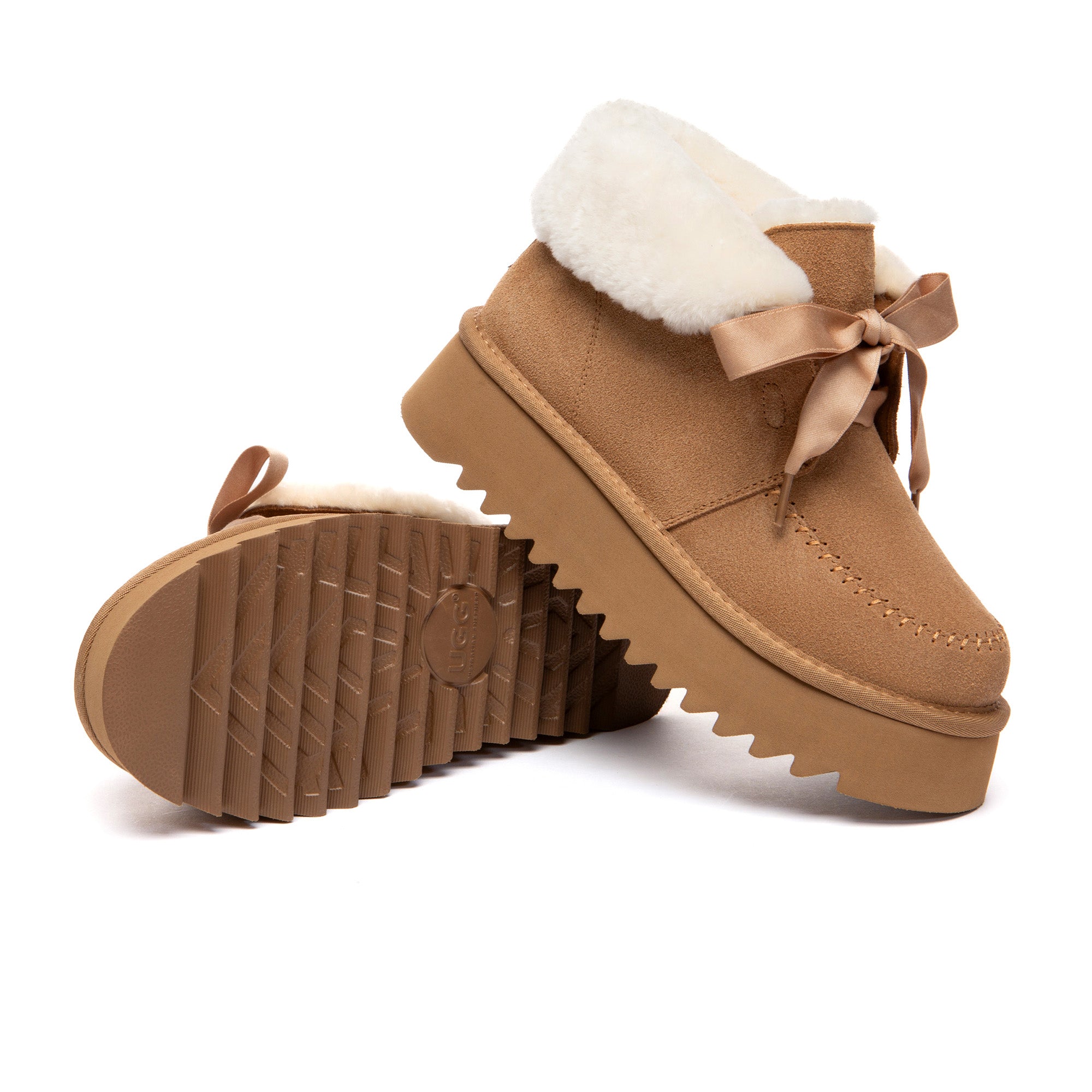 EverUgg cozy lace-up bow platform boots with quilted design and chunky soles, perfect for stylish winter wear.