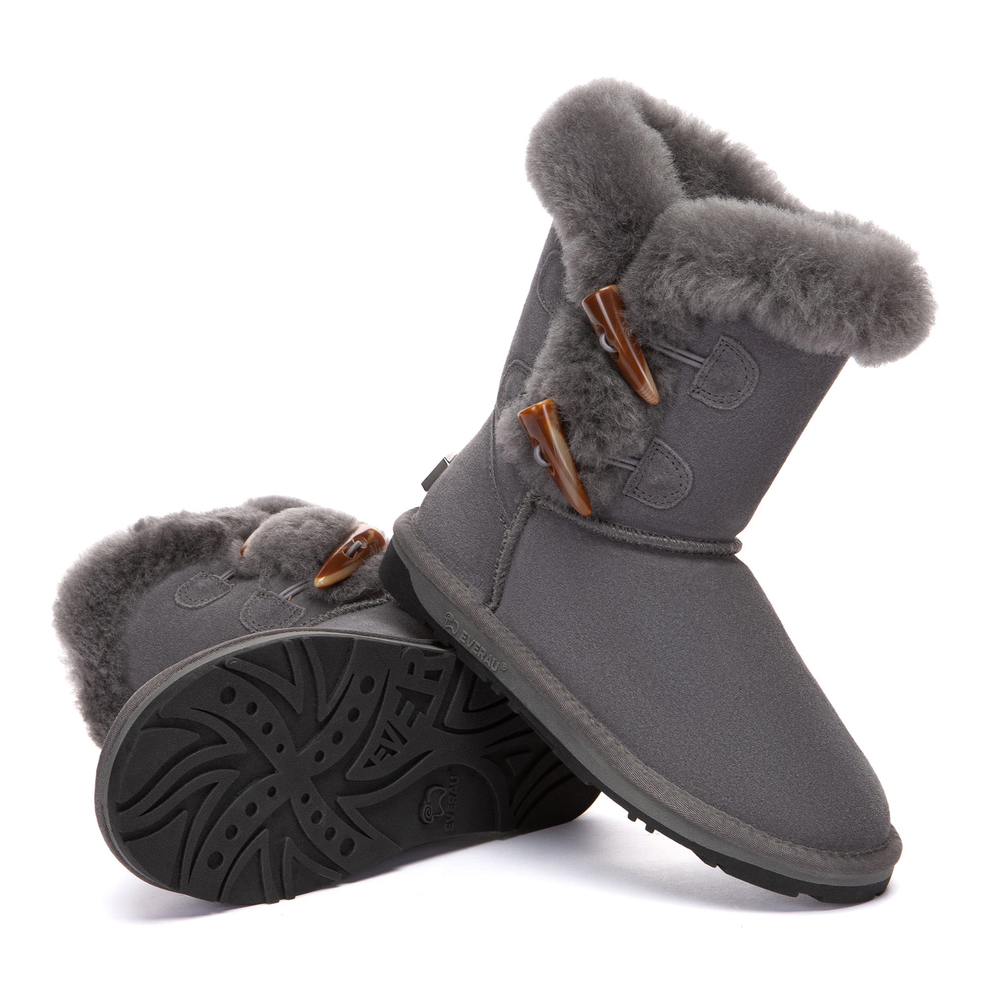EverUgg Talia Shark 2-Button UGG Boots featuring plush lining and stylish design, shown in a natural outdoor setting.