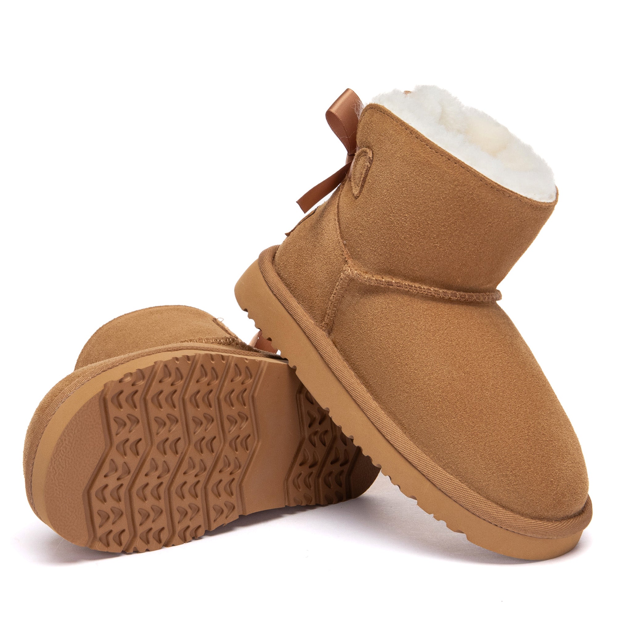 Kids mini classic UGG boots with back bow detail in soft, cozy fur-lined style by EverUgg
