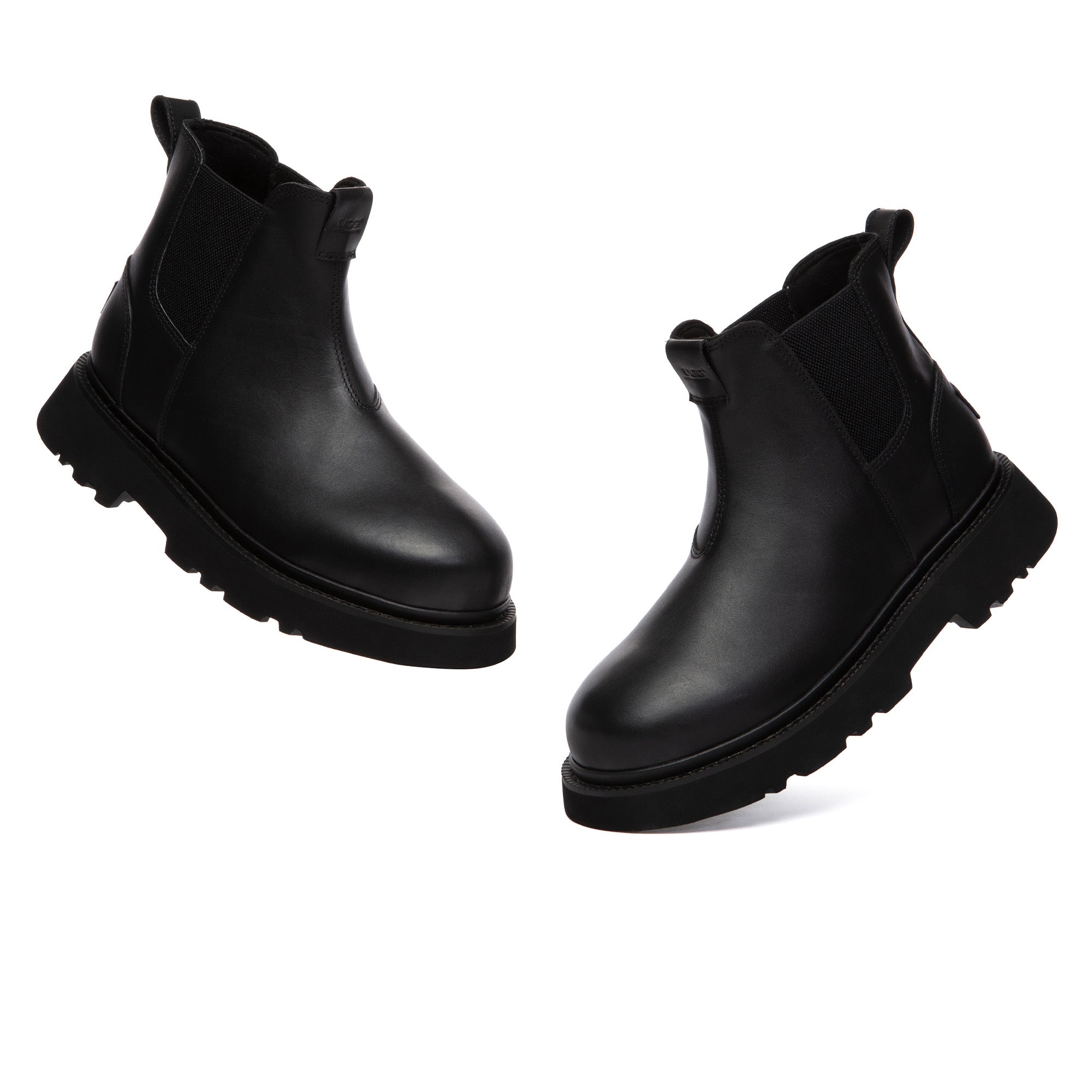 Men's black Chelsea leather boots by EverUgg featuring sleek design, elastic side panels, and sturdy leather construction.