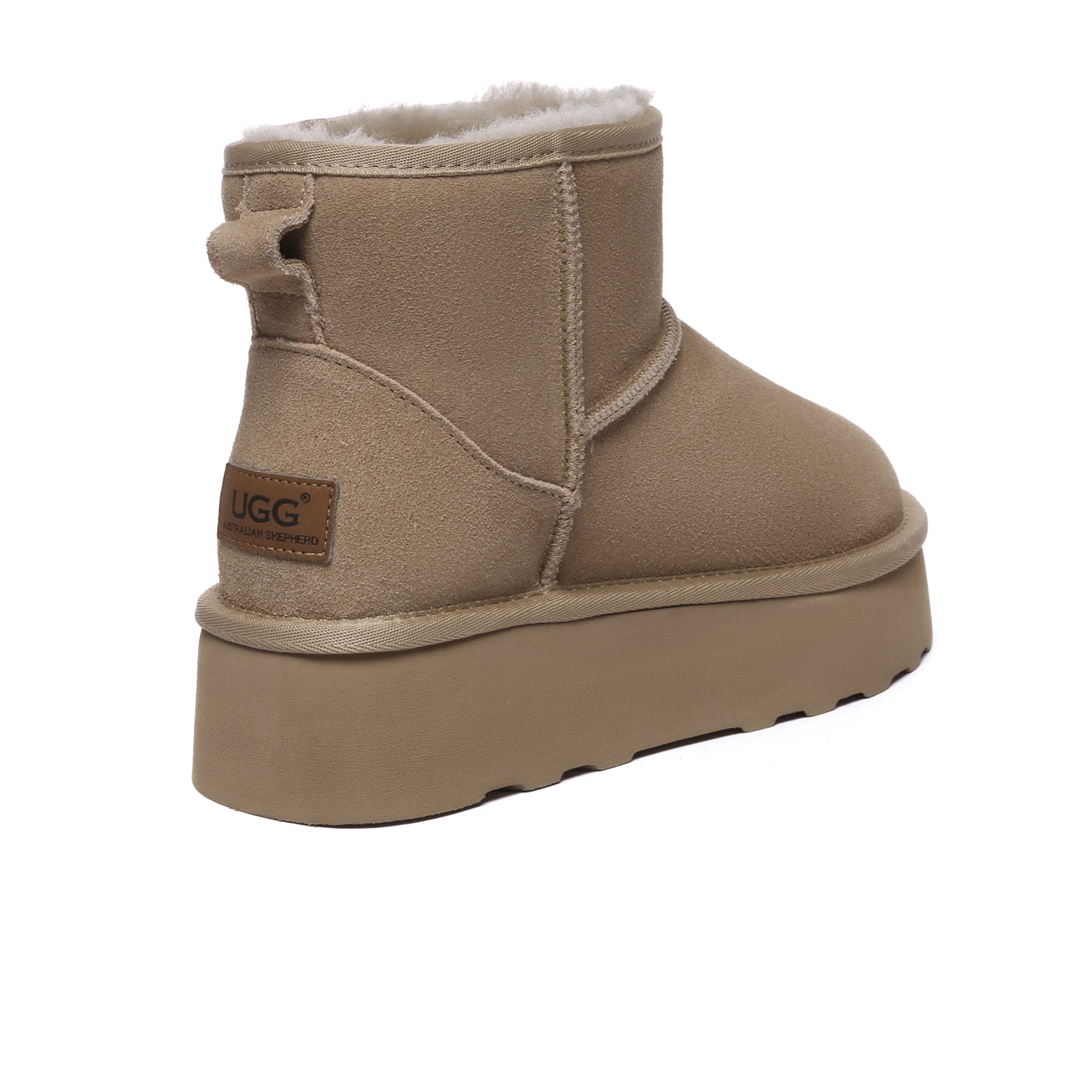 EverUgg Mini Premium UGG platform boots, stylish shoes with a chunky sole and cozy shearling lining, shown from the side.