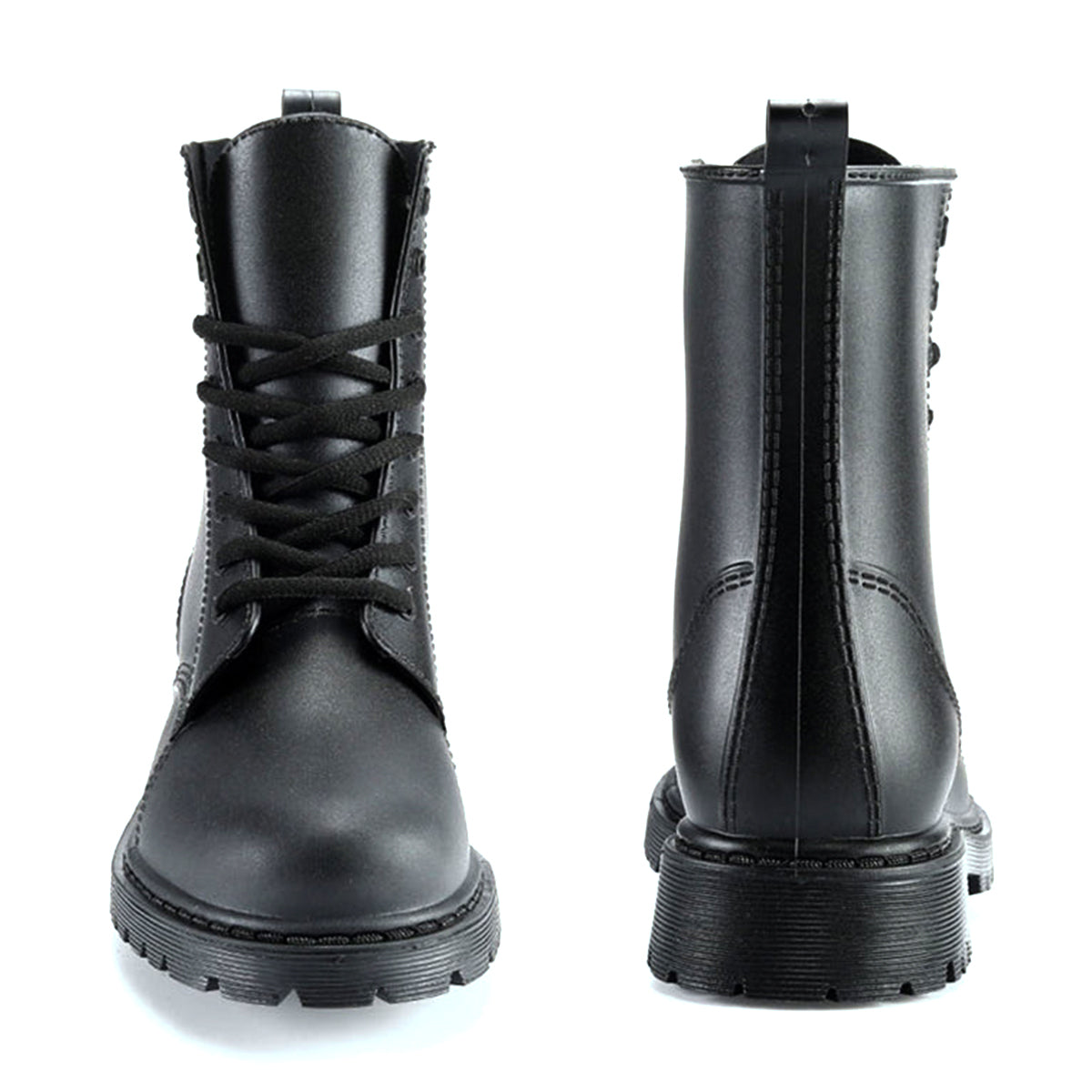 AllSlides Nomad Black waterproof boots displayed outdoors in rain, showcasing durable footwear for wet weather.