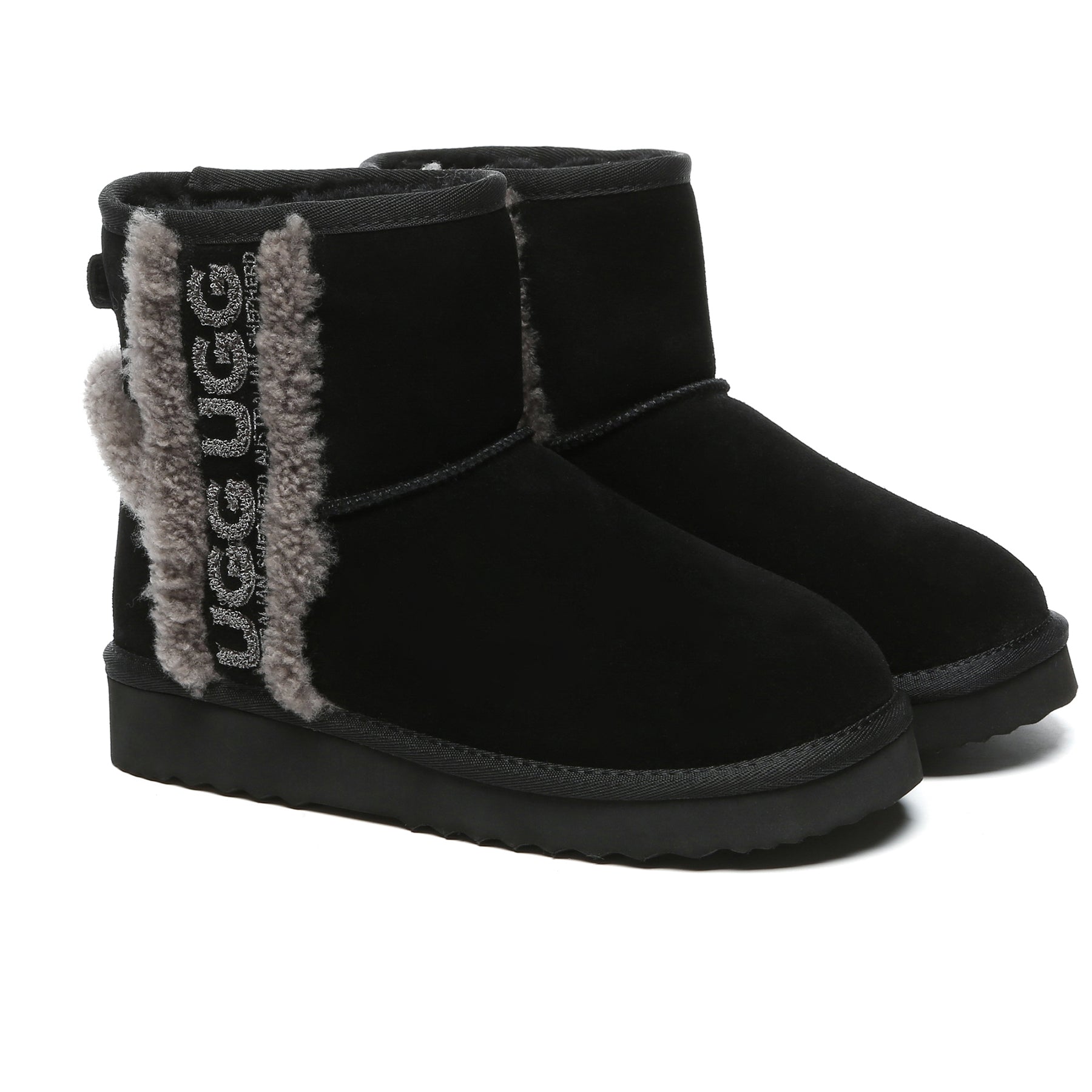 Black shearling wool side mini UGG boots for women by EverUgg, showing the cozy interior and stylish exterior.