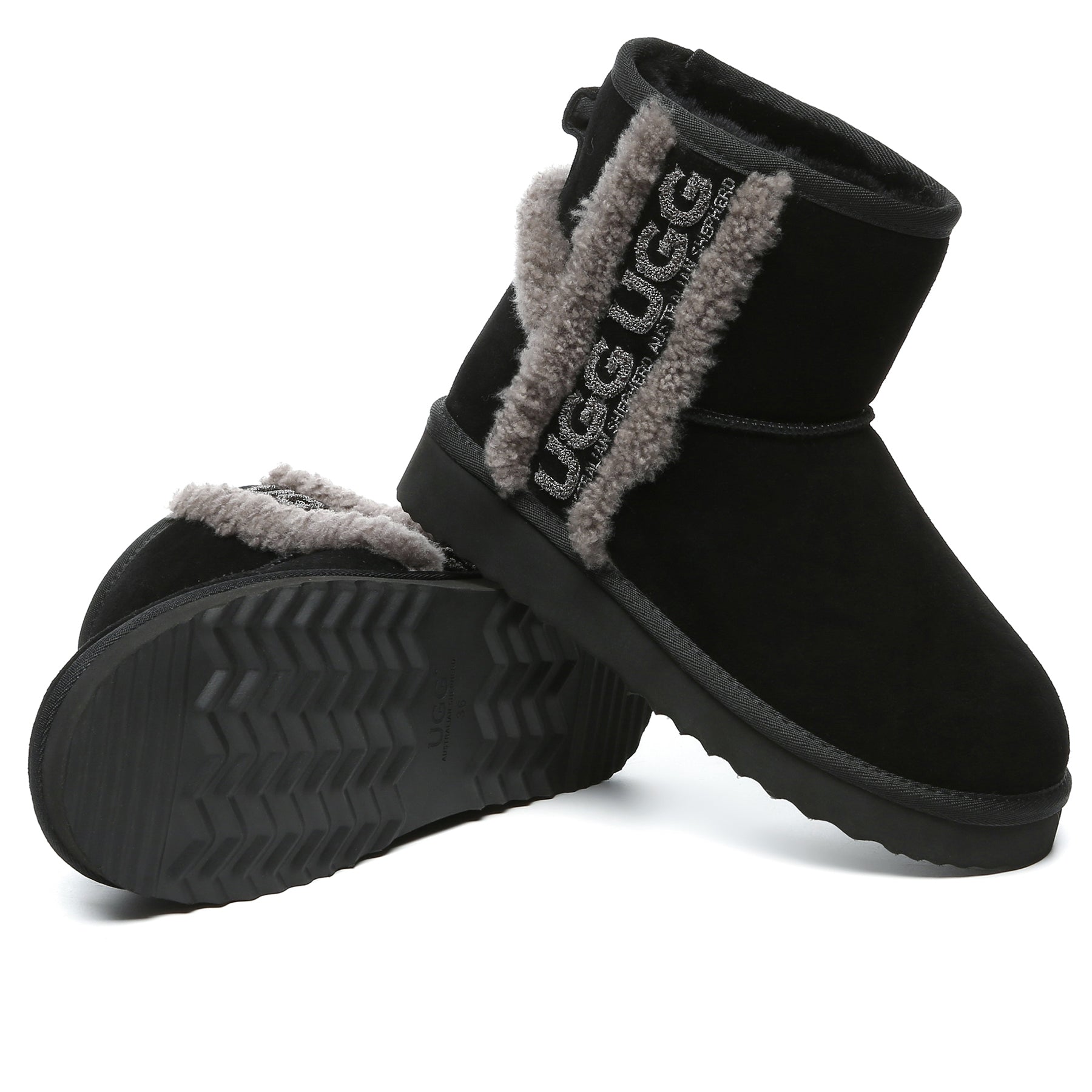 Black shearling wool side mini UGG boots for women by EverUgg, showcasing cozy interior and sleek ankle-height design.