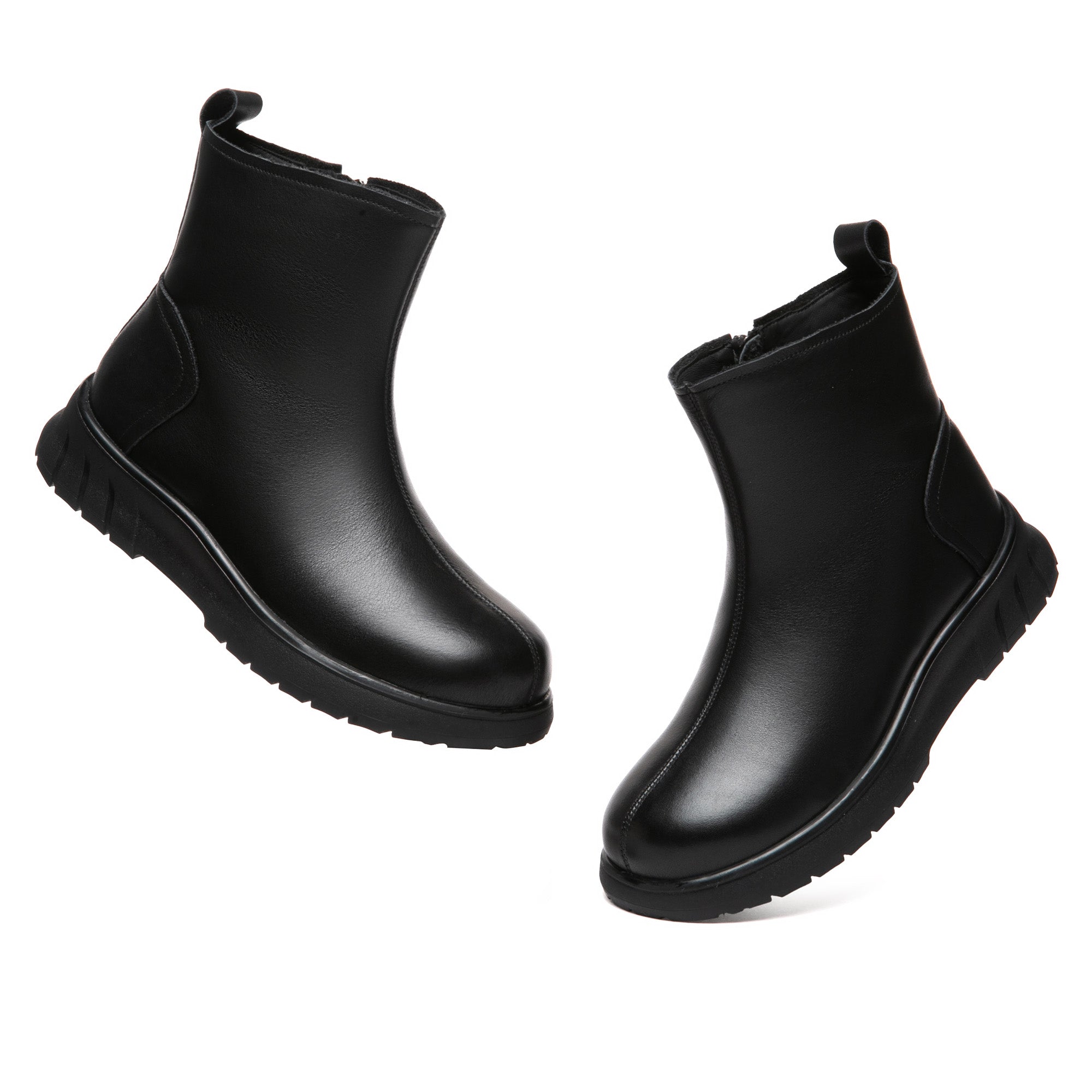 EverUgg Sheepskin Classic Black Leather Boots featuring smooth leather exterior and cozy sheepskin lining.