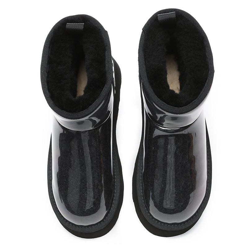 Black transparent platform UGG boots by EverUgg featuring clear plastic soles and classic UGG style.