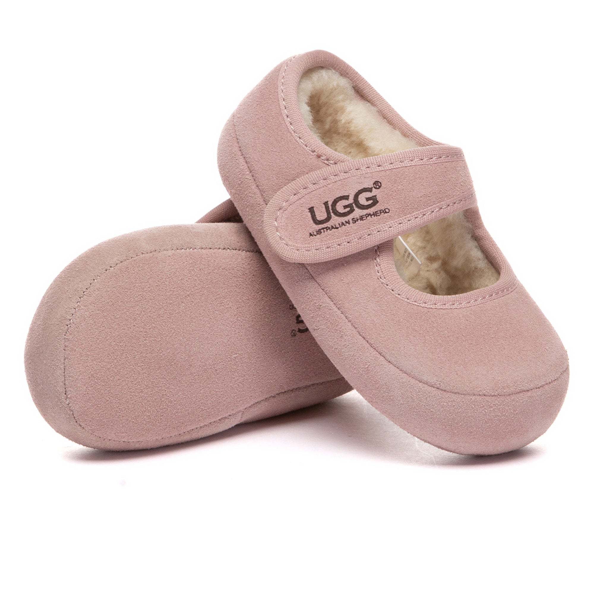 Kids UGG Millie Toddler Slippers by EverUgg featuring soft pink UGG boots with plush lining and strap for cozy comfort.