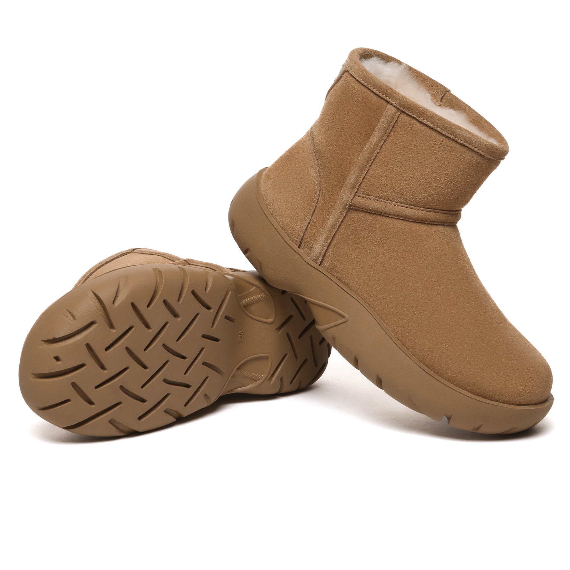 EverUgg UGG Mini Explorer Platform Boots in tan with rugged sole and lace-up design, showcasing their stylish and durable look.