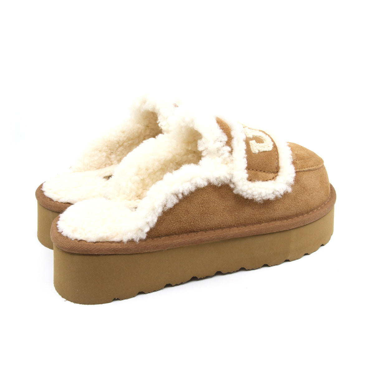 Auzland UGG shearling platform slippers in chestnut, showing soft shearling lining and sturdy sole for cozy indoor wear.
