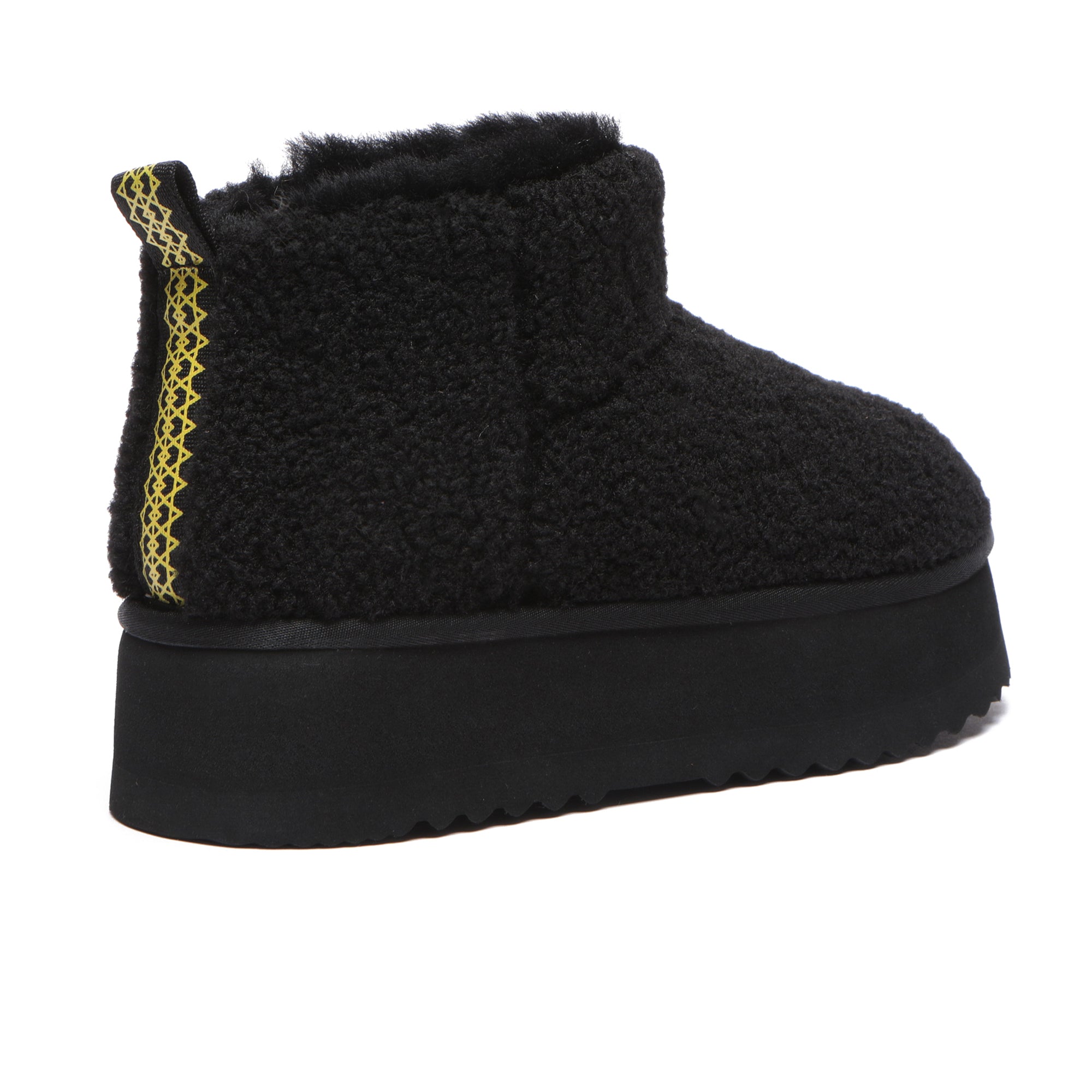 Black Ultra Mini TeddyFluff UGG Boots by EverUgg with plush fur detailing and platform sole, perfect for cozy winter style.