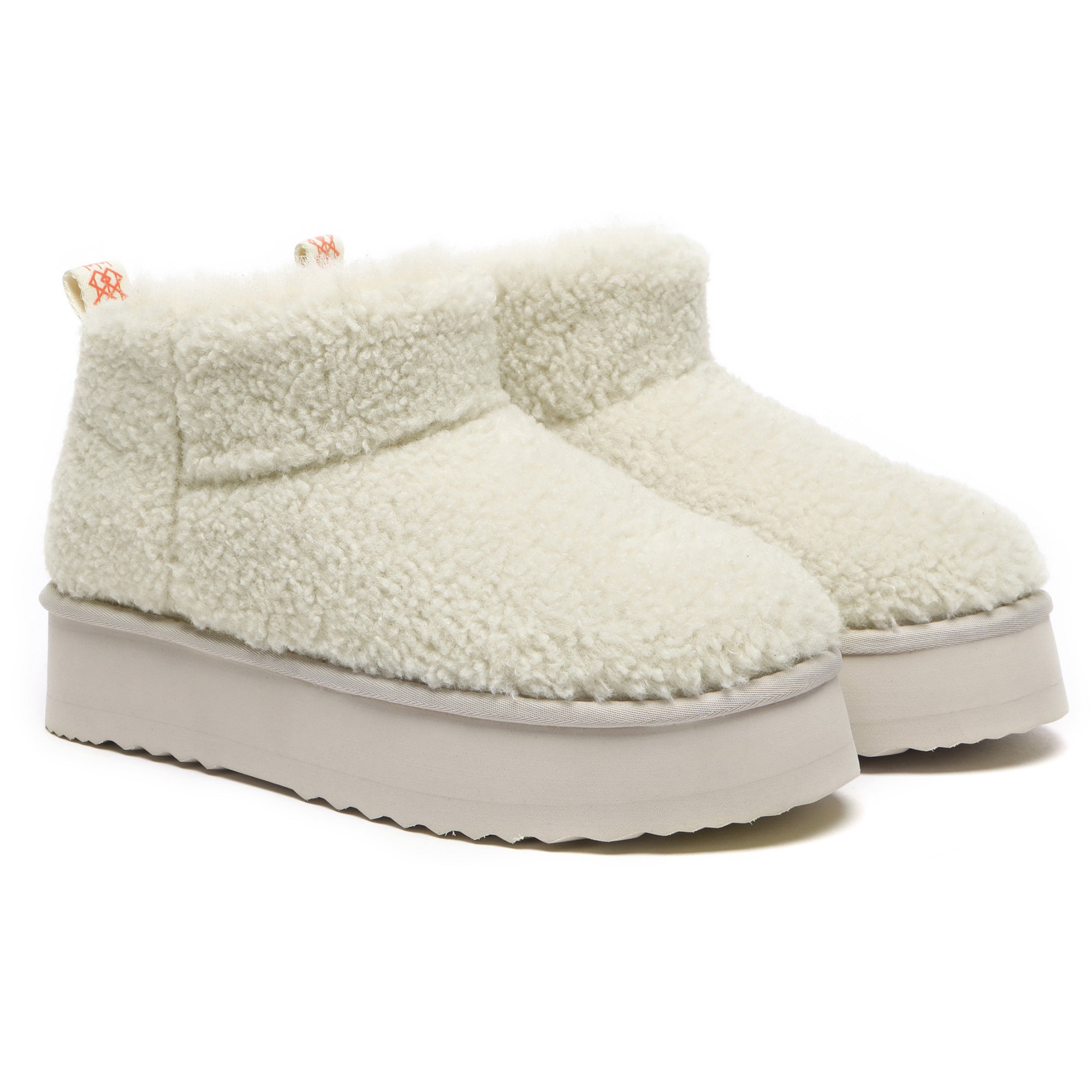 EverUgg Ultra Mini TeddyFluff Platform UGG Boots in sand color with plush interior and rugged sole, showcasing a stylish winter footwear design.