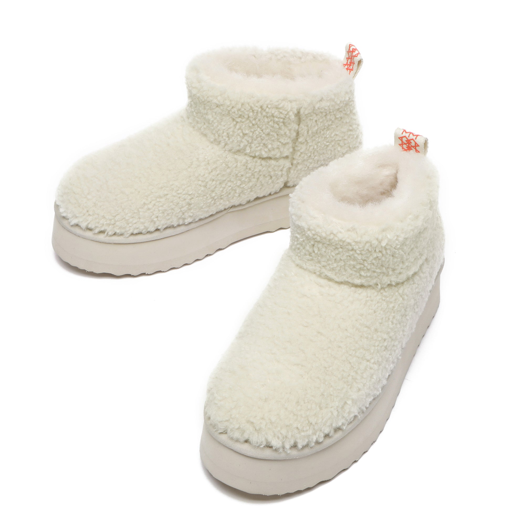 EverUgg Ultra Mini TeddyFluff Platform UGG Boots in sand color with plush fur exterior and chunky sole, stylish and cozy footwear.