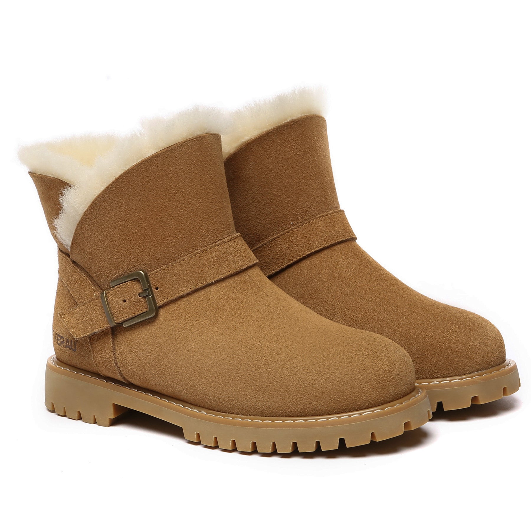 Women’s EverUgg buckle mini UGG boots with leather straps and cozy shearling lining, stylish winter footwear.