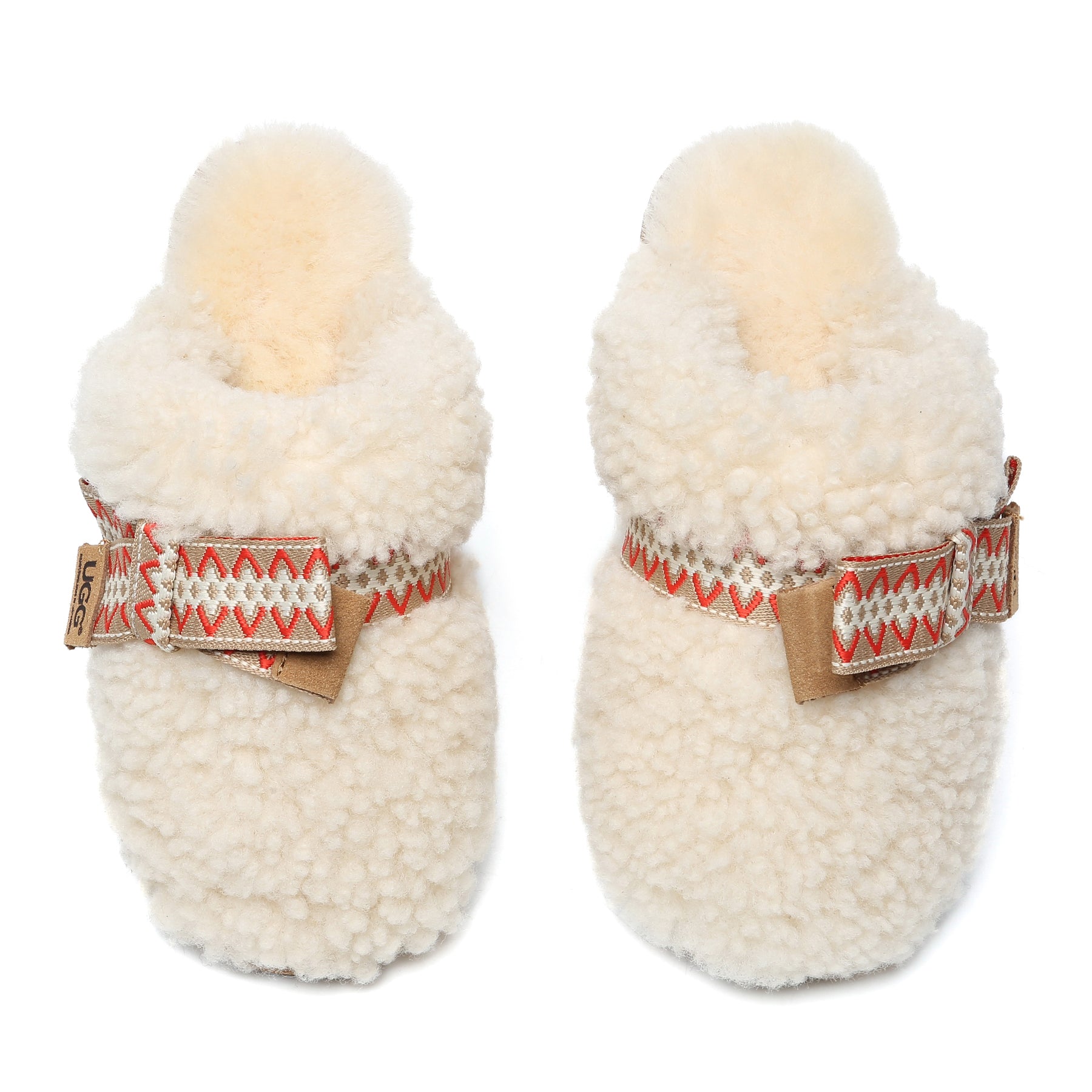 Cream UGG slippers with wool bow stitch detail, women's slip-on shoes from EverUgg featuring cozy, plush interior and soft sole.