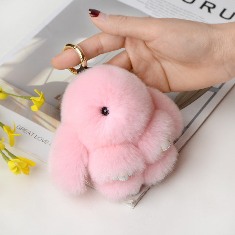 Snuggyz bunny keychain featuring a cute plush bunny with a silver keyring for keys or bags.