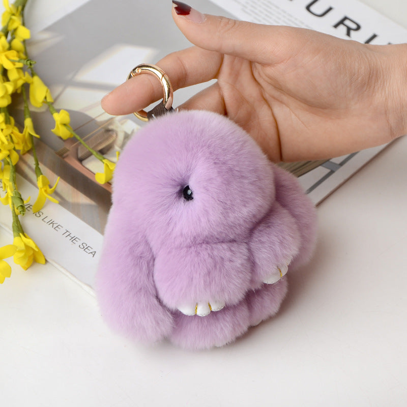 Snuggyz Bunny Keychain featuring a cute plush bunny with a silver keyring, perfect for attaching to keys or bags.