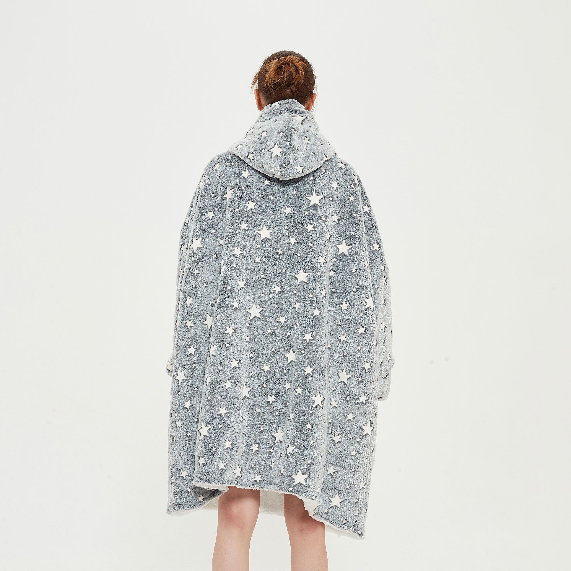 Snuggyz glow in the dark stars hoodie blanket showing a soft, cozy hoodie with star patterns and glowing details.