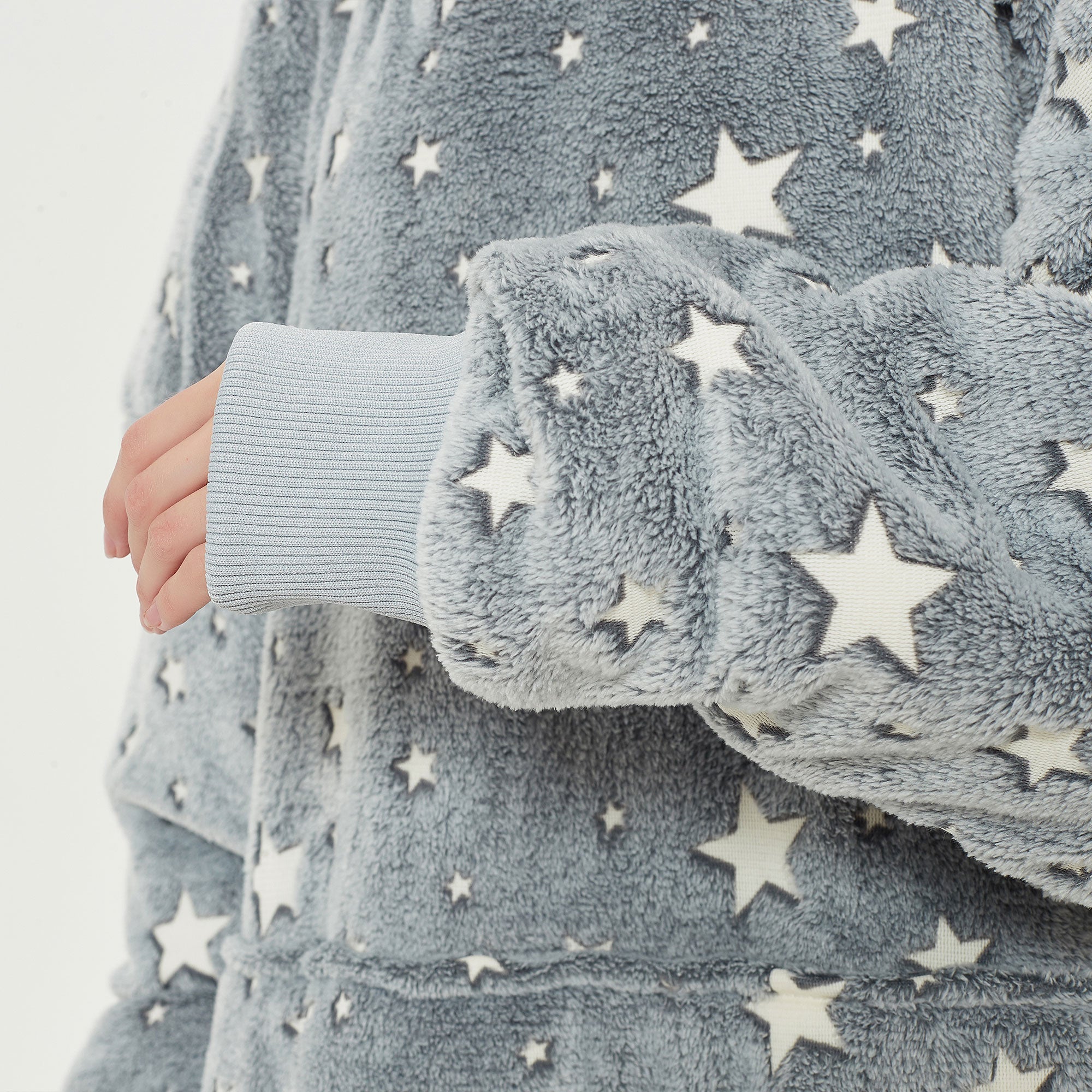 Snuggyz glow-in-the-dark stars hoodie blanket showing soft fabric and star patterns on a cozy hoodie-style blanket.