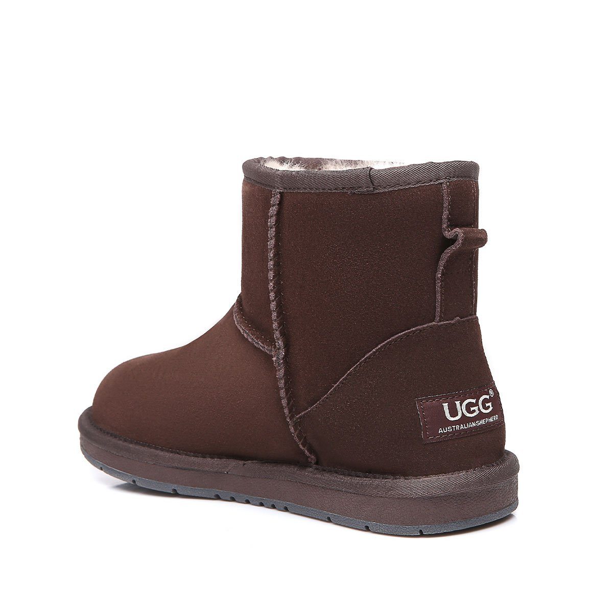 Mini classic suede UGG boots for women in tan with plush sheepskin lining, featuring a rounded toe and slip-on style.