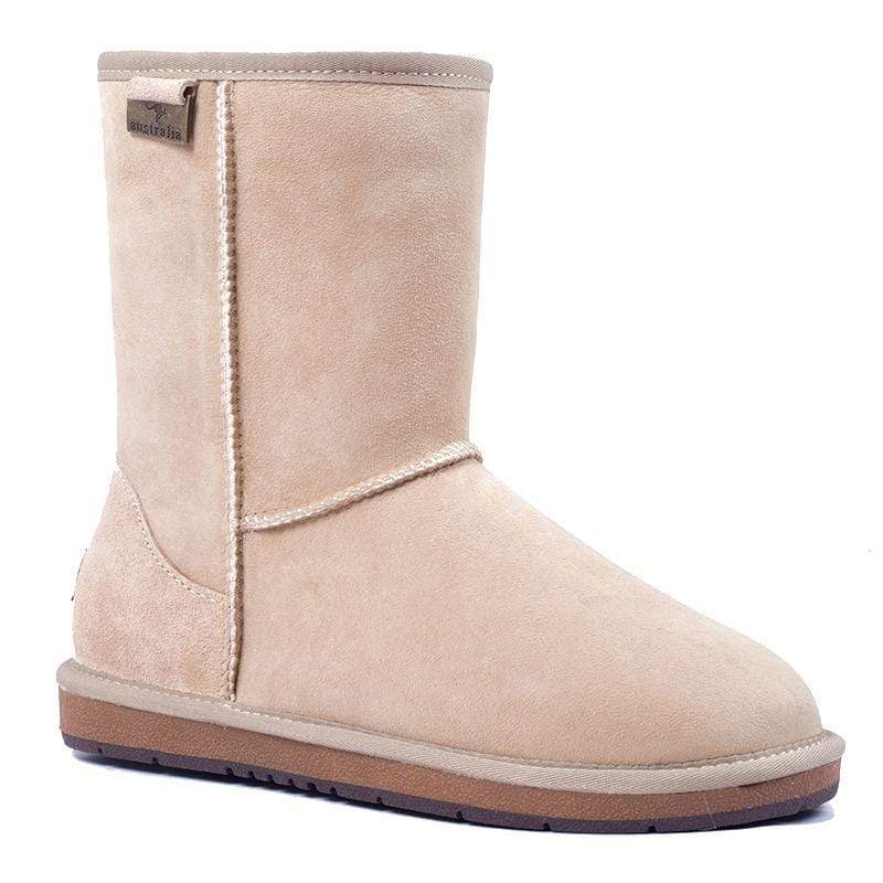 A pair of Auzland premium short classic UGG boots for women in sand color, showcasing cozy sheepskin lining and stylish design.