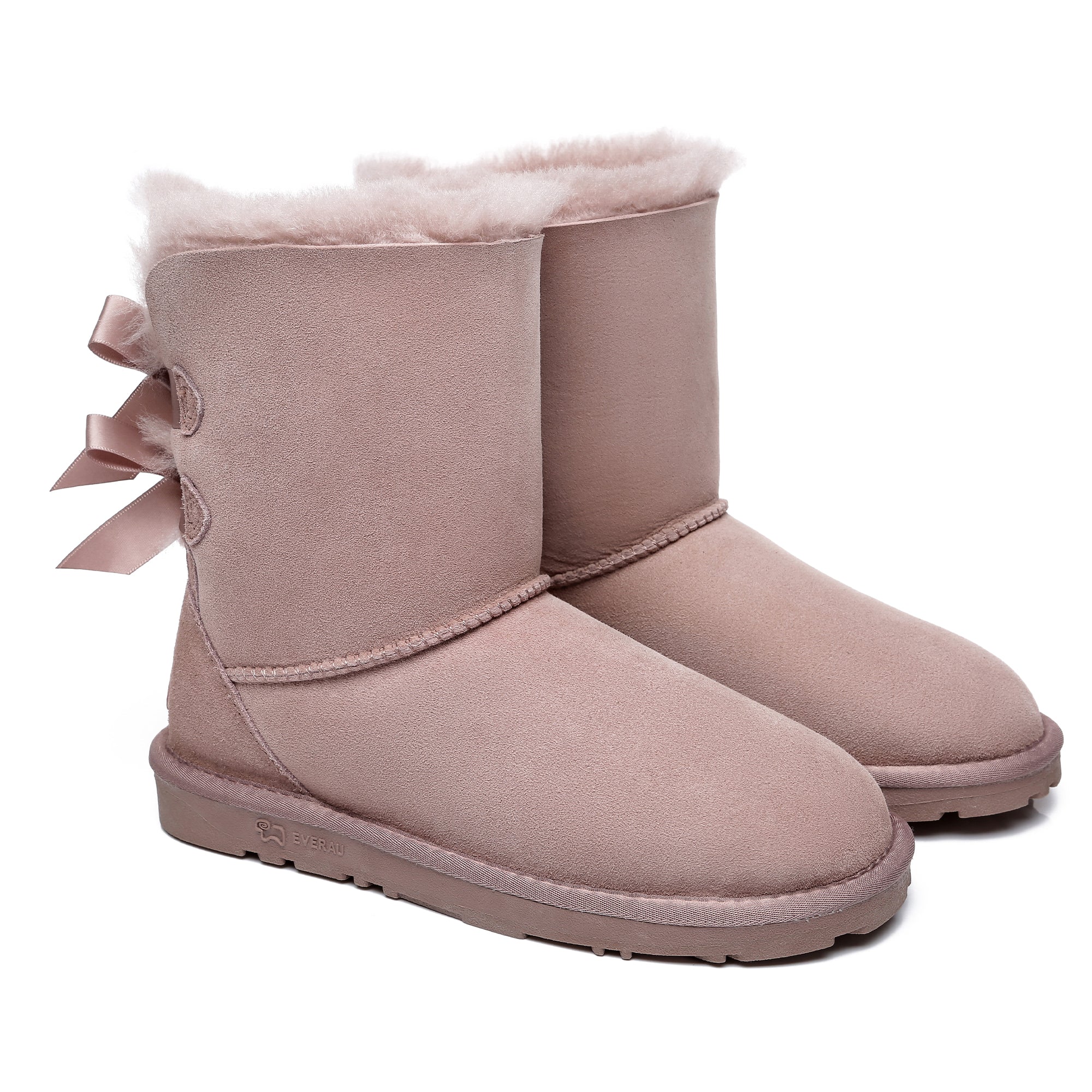 Pink EverUgg short double bow women's UGG boots with stylish design and cozy shearling lining, perfect for cold weather fashion.