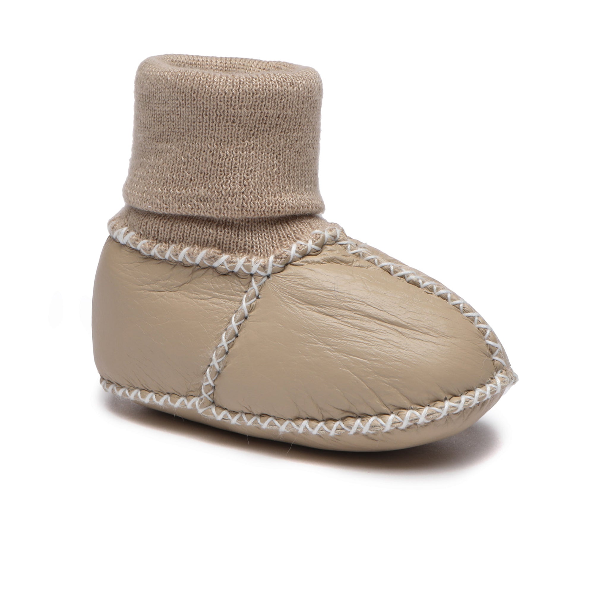 Soft beige EverUgg baby booties with plush lining, designed for cozy comfort for infants, featuring a slip-on style and durable sole.