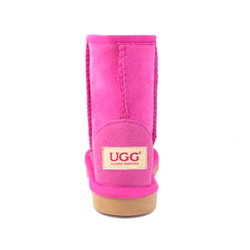 Auzland pink UGG Kids short classic boots with cozy sheepskin lining and soft suede exterior for young children.