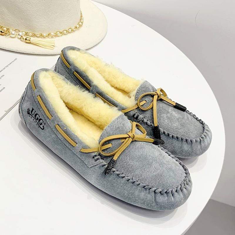 AuSnow UGG Ozsnow Premium Moccasin women's slippers with soft suede exterior and cozy interior for comfortable indoor wear.