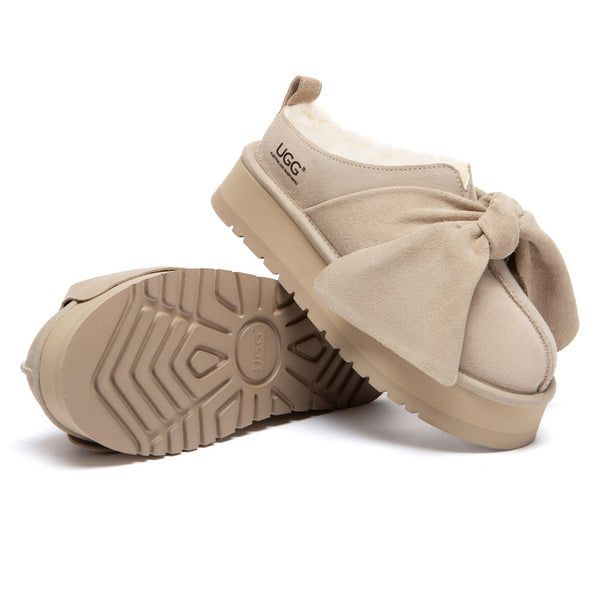 EverUgg Ultra Bow Platform UGG Slippers featuring a plush design and stylish bow detail on soft, comfortable slippers.