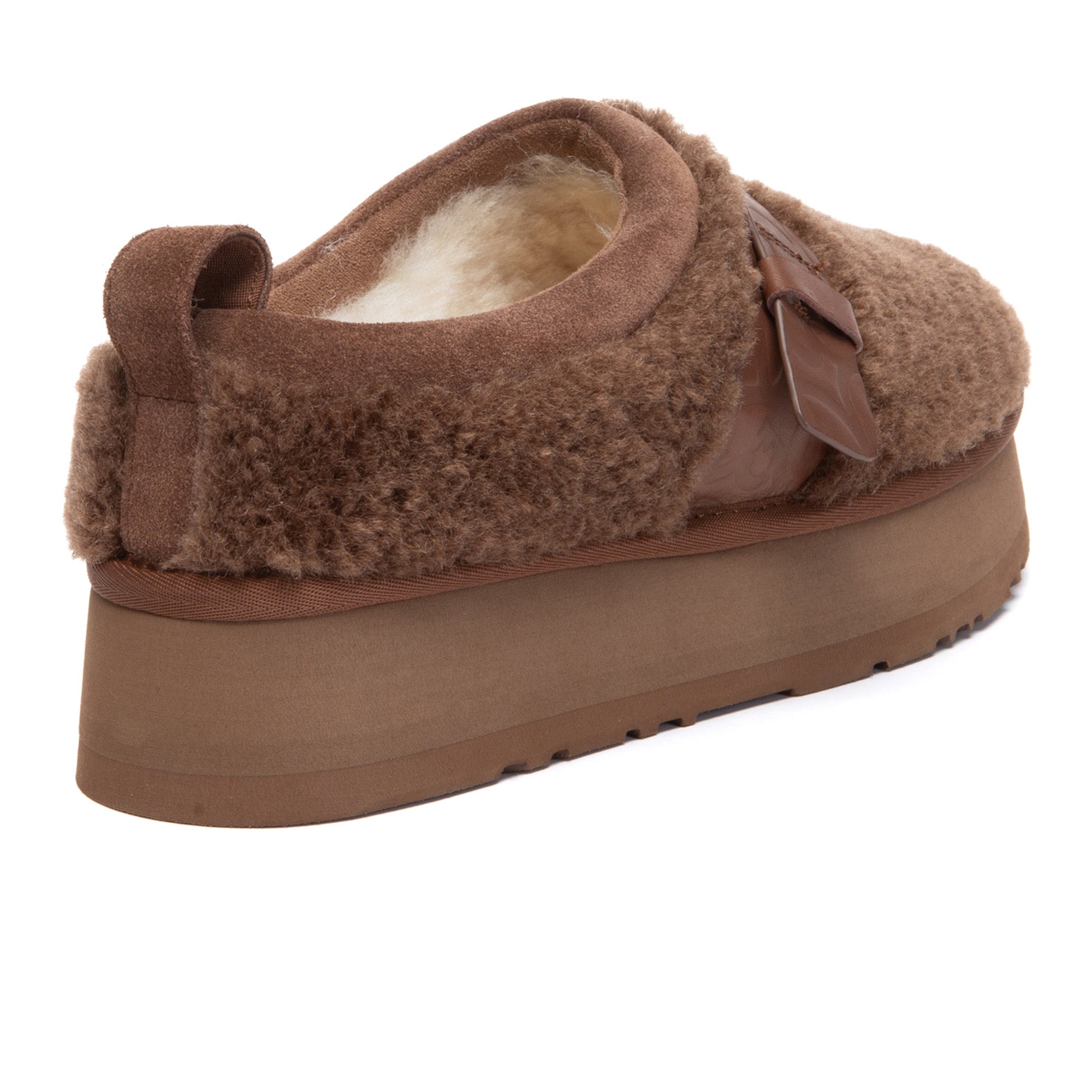 EverUgg ankle shearling platform UGG slippers featuring plush shearling lining and sturdy platform sole.