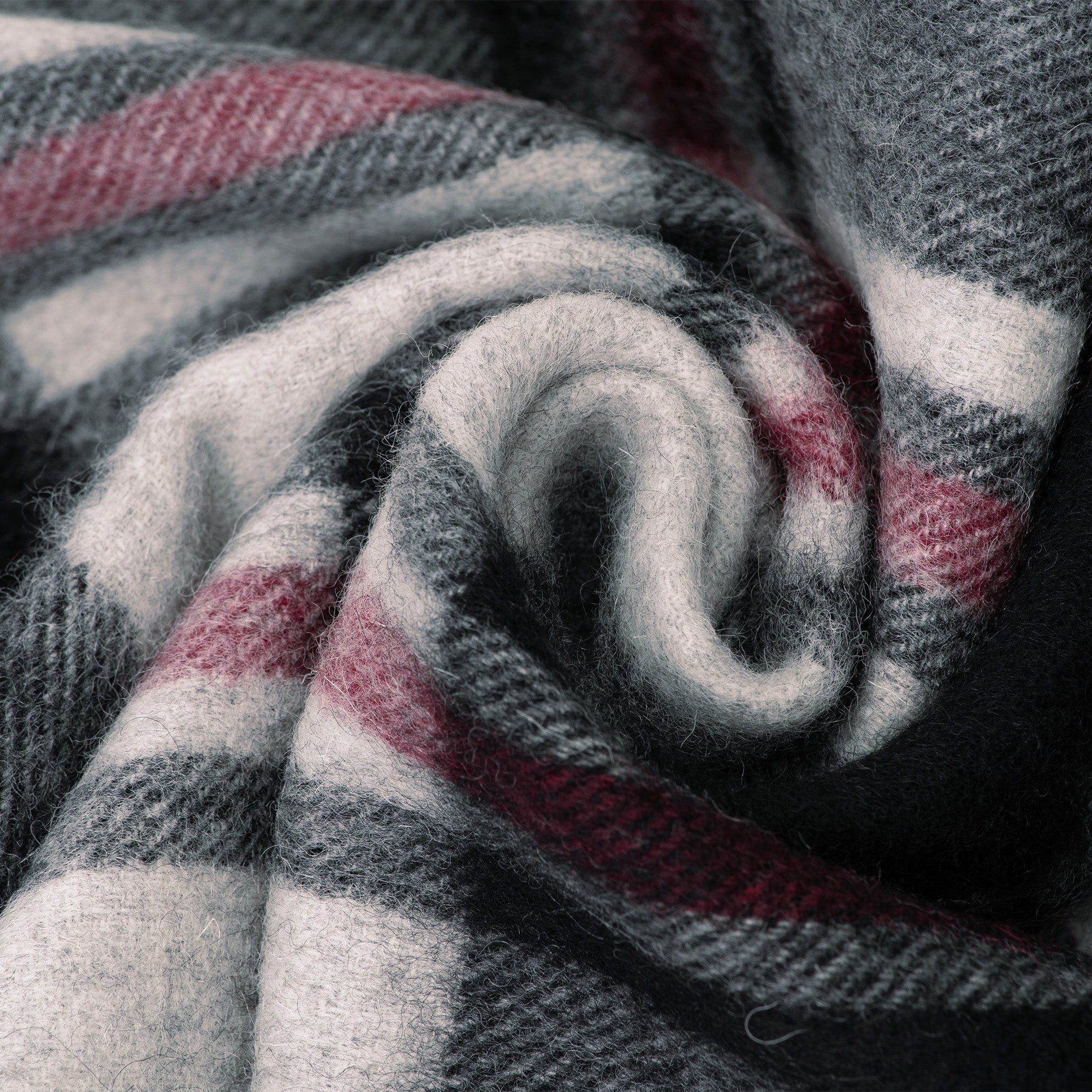 Australian Merino Wool check scarf in black and grey, stylish and warm, by EverUgg, displayed flat with fringed edges.