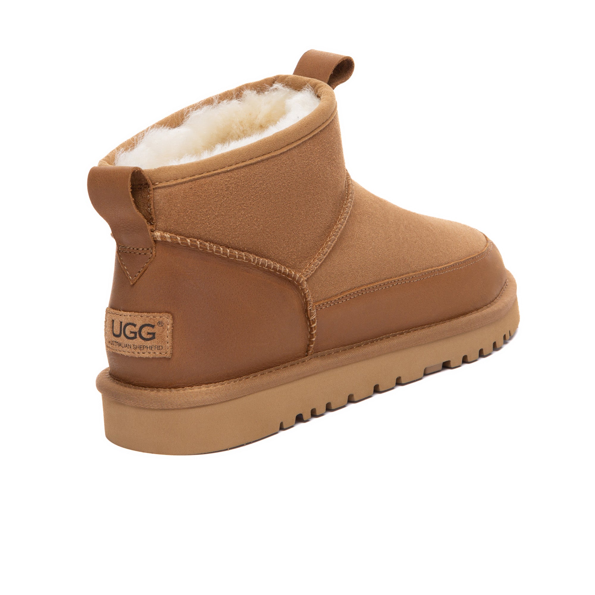 EverUgg Tabs Ultra Mini Ankle UGG Boots in beige with plush fur lining and suede exterior, shown on a model's feet.