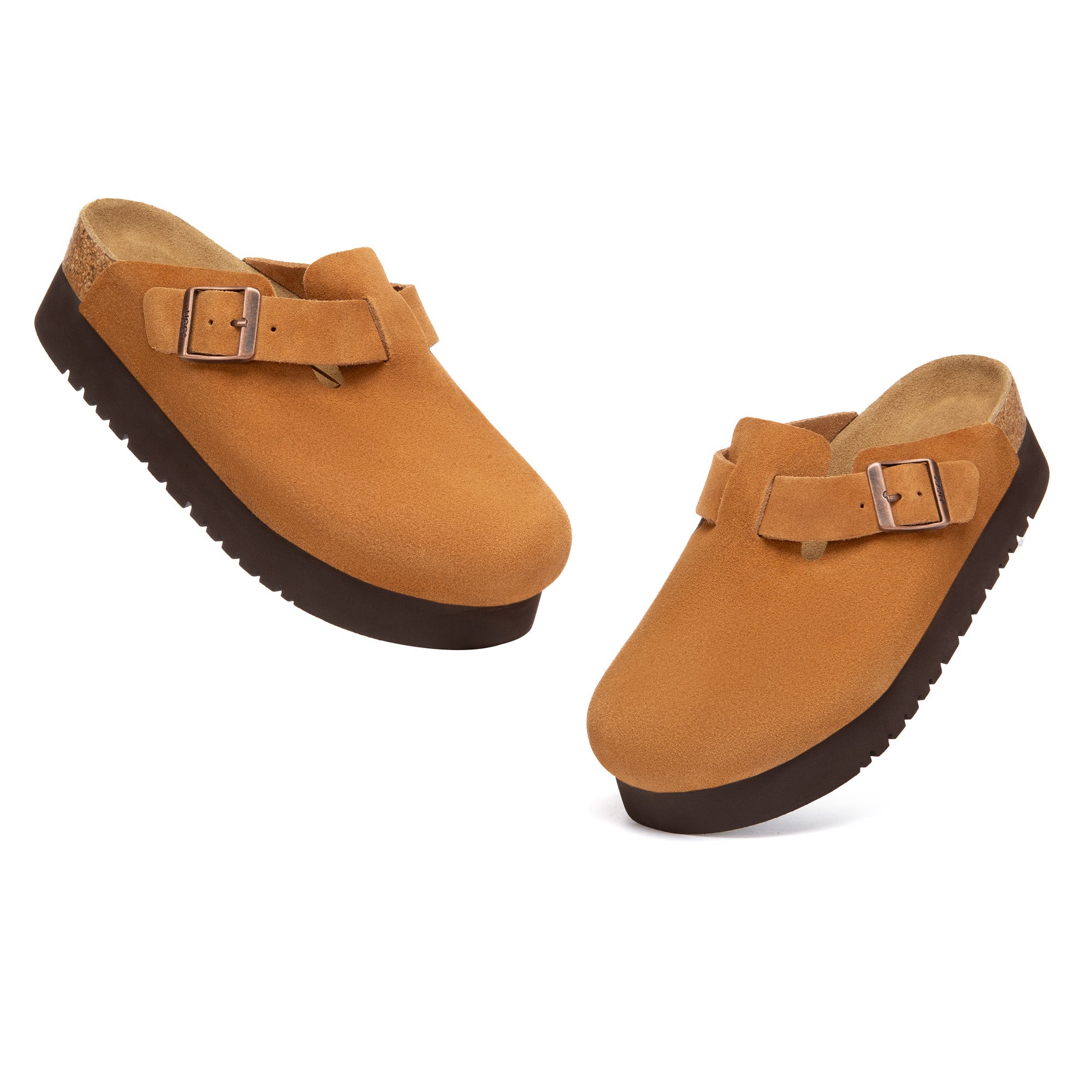 EverUgg Birkie Suede Buckle Platform Clogs slippers with buckle detail and platform sole, shown in a cozy indoor setting.