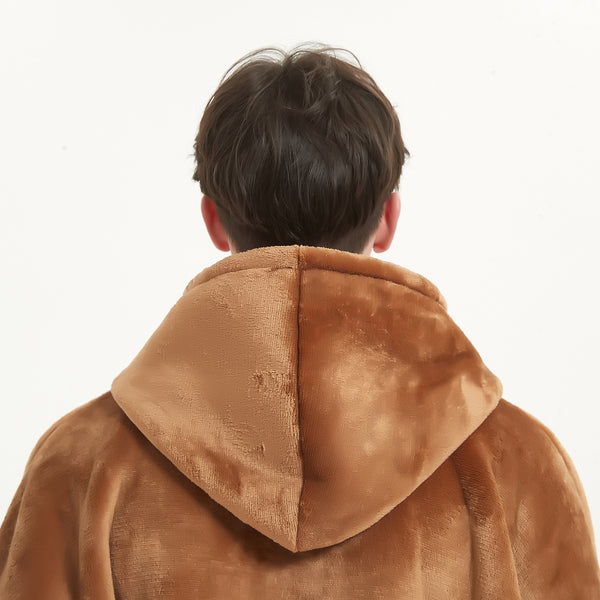 Snuggyz Chestnut Hoodie Blanket draped on a chair, showcasing its cozy hooded design and soft fleece material for warmth.