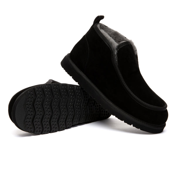 EverUgg Classic Mini Ankle Boots in suede with plush lining, shown on a model's feet highlighting their stylish design.