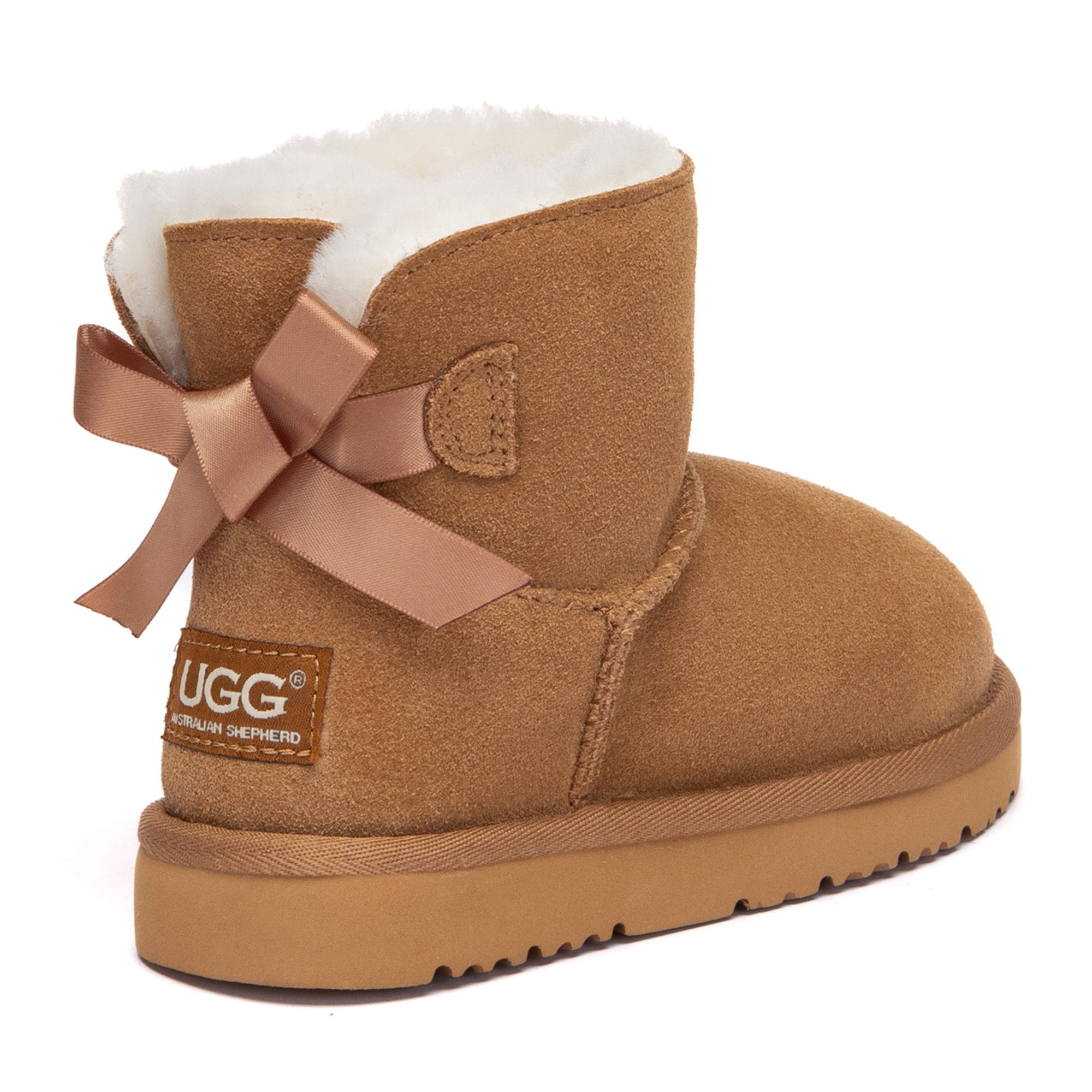 Kids mini classic UGG boots with back bow design by EverUgg, featuring soft suede material and cozy interior for warmth and style.