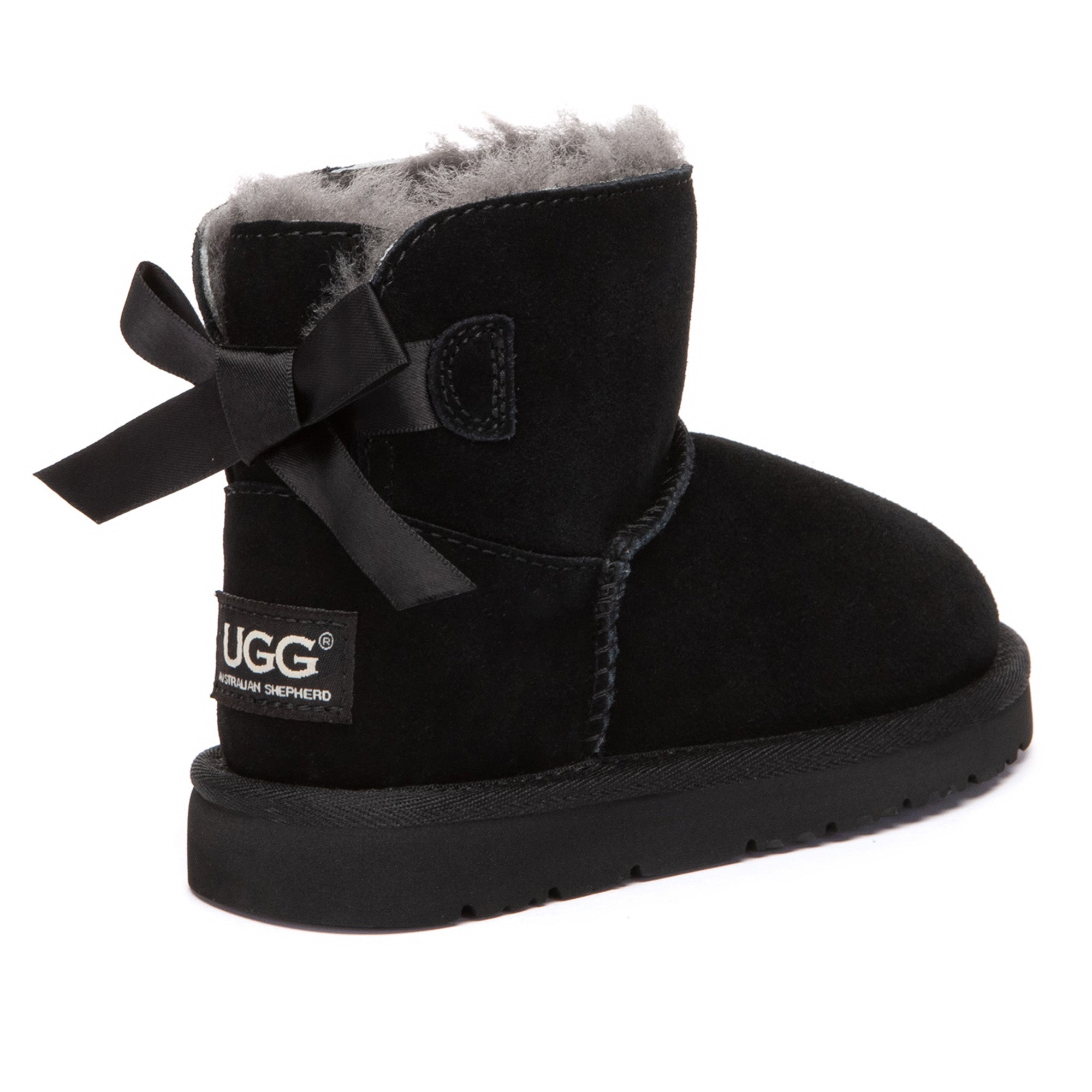 Kids mini UGG boots by EverUgg with classic back bow, featuring soft fur lining and durable suede exterior.