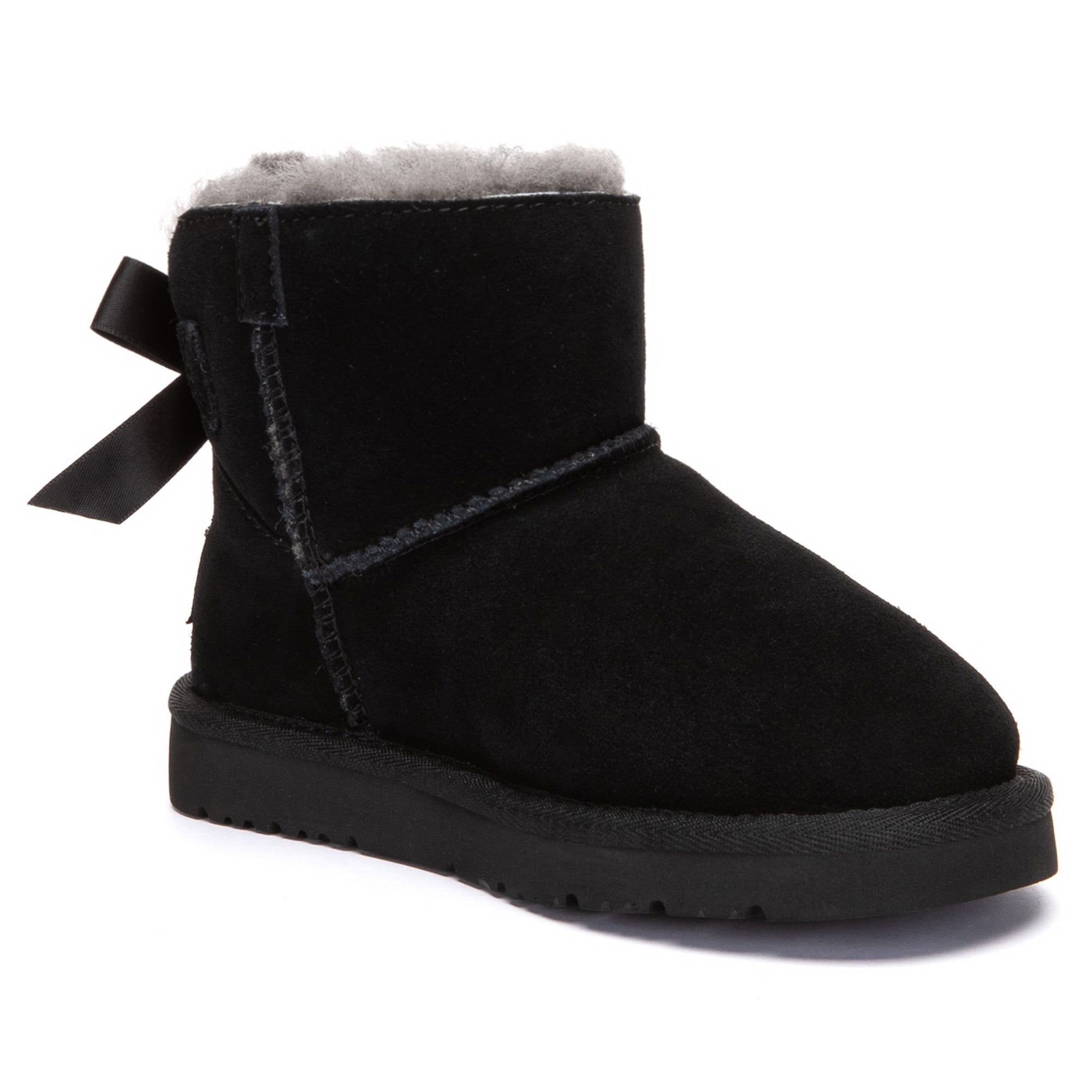 Kids mini classic UGG boots with back bow detail in soft suede, featuring plush lining and durable rubber sole.