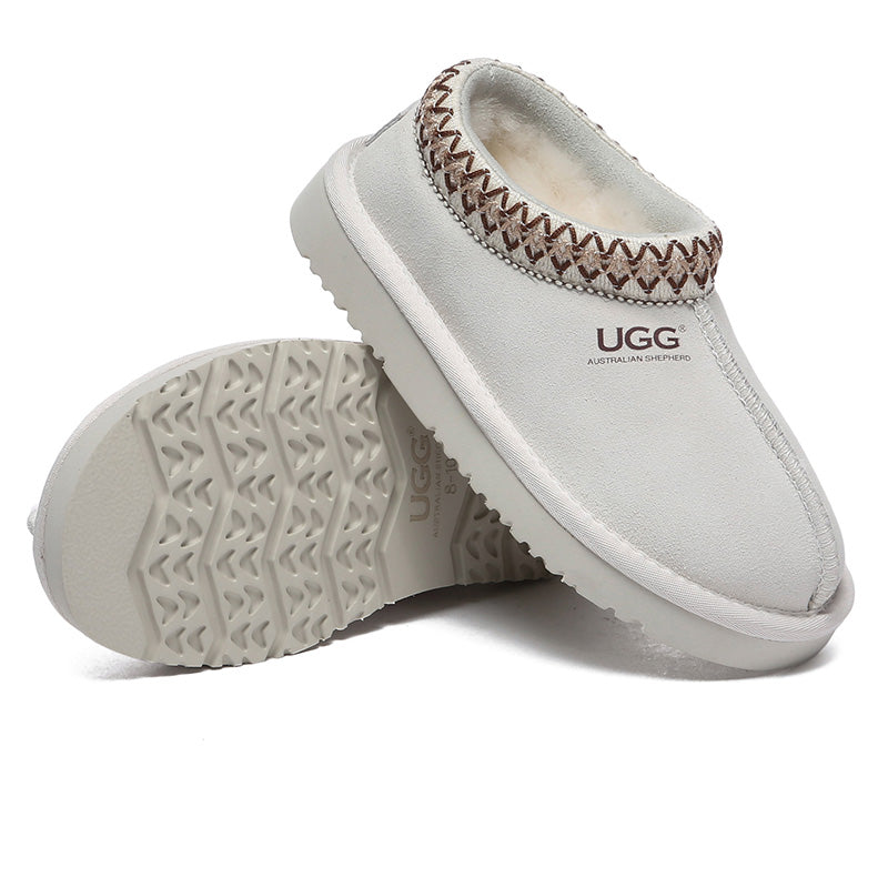 Kids' UGG slippers by EverUgg featuring soft, cozy sheepskin lining and slip-on design for comfort and warmth.
