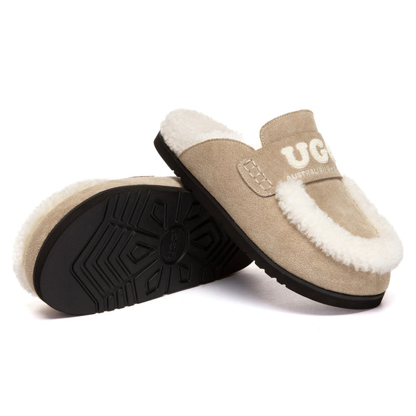 EverUgg Laura shearling logo slippers with plush interior and cozy design, featuring UGG branding and soft shearling material.