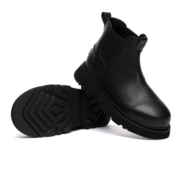 Men's black Chelsea leather boots by EverUgg featuring sleek design and elastic side panels, perfect for stylish footwear.