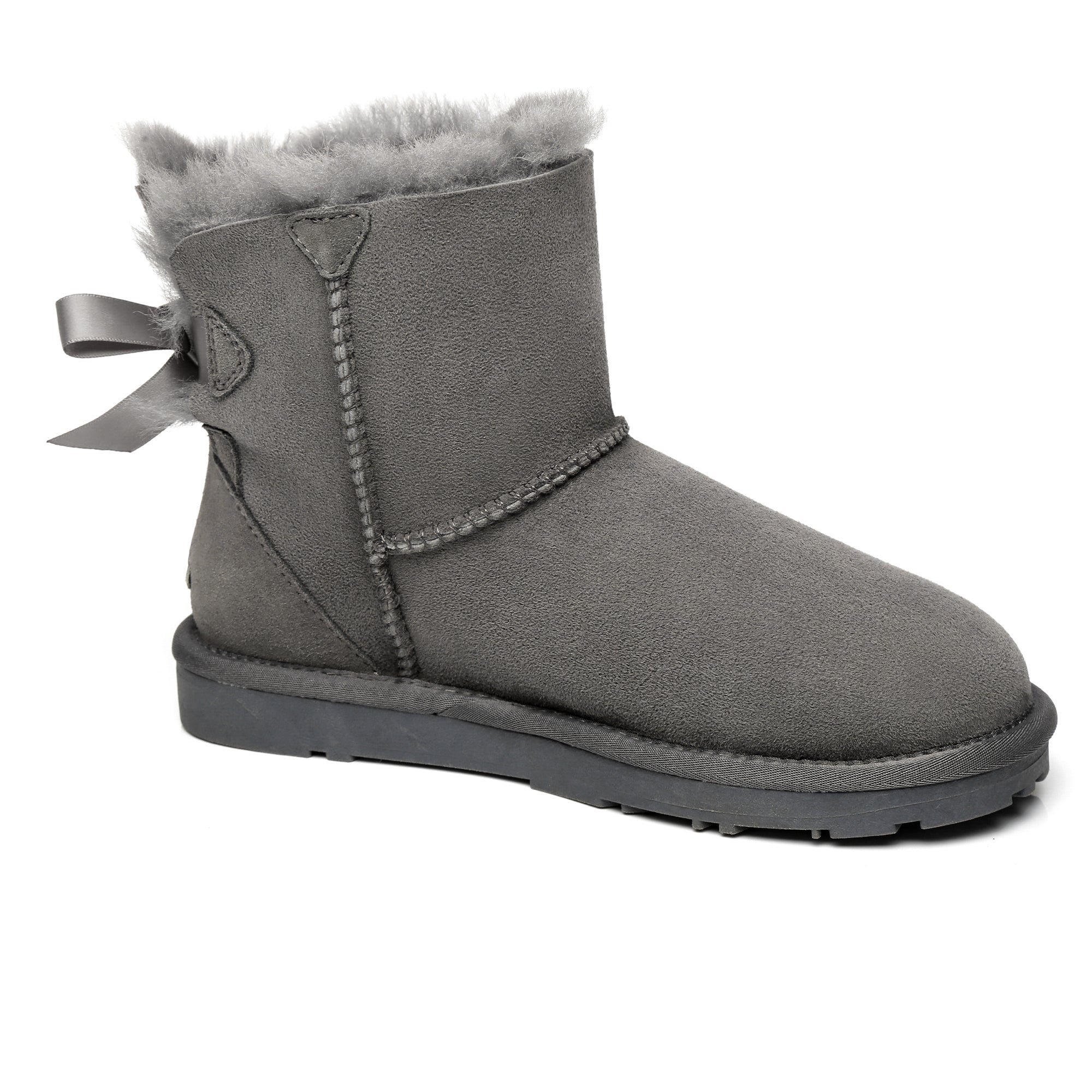 EverUgg Mini Back Bow UGG Boots in neutral color with a back bow detail, showcasing cozy sheepskin lining and stylish design.