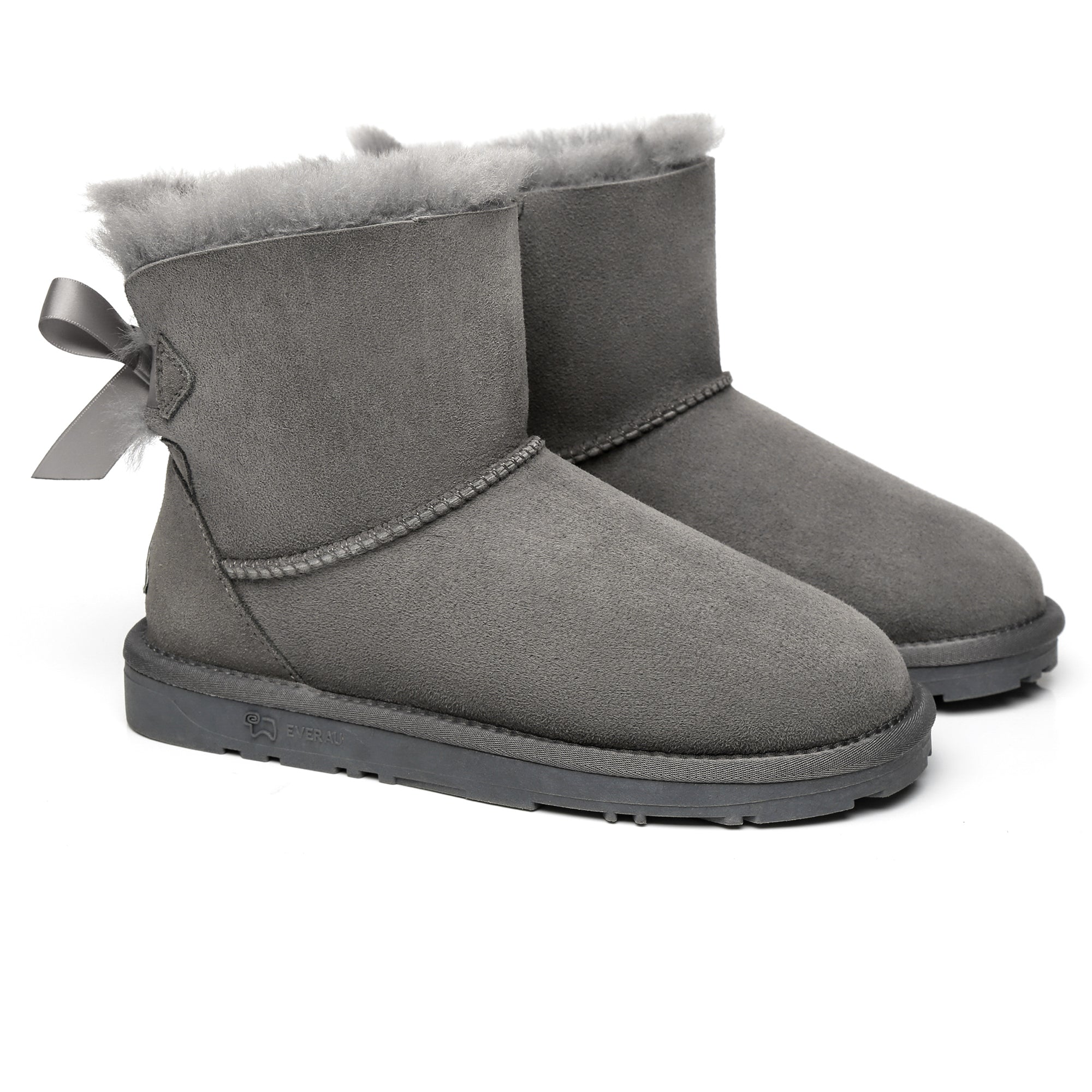EverUgg Mini Back Bow UGG Boots showing a cozy black leather exterior with a decorative bow at the back.