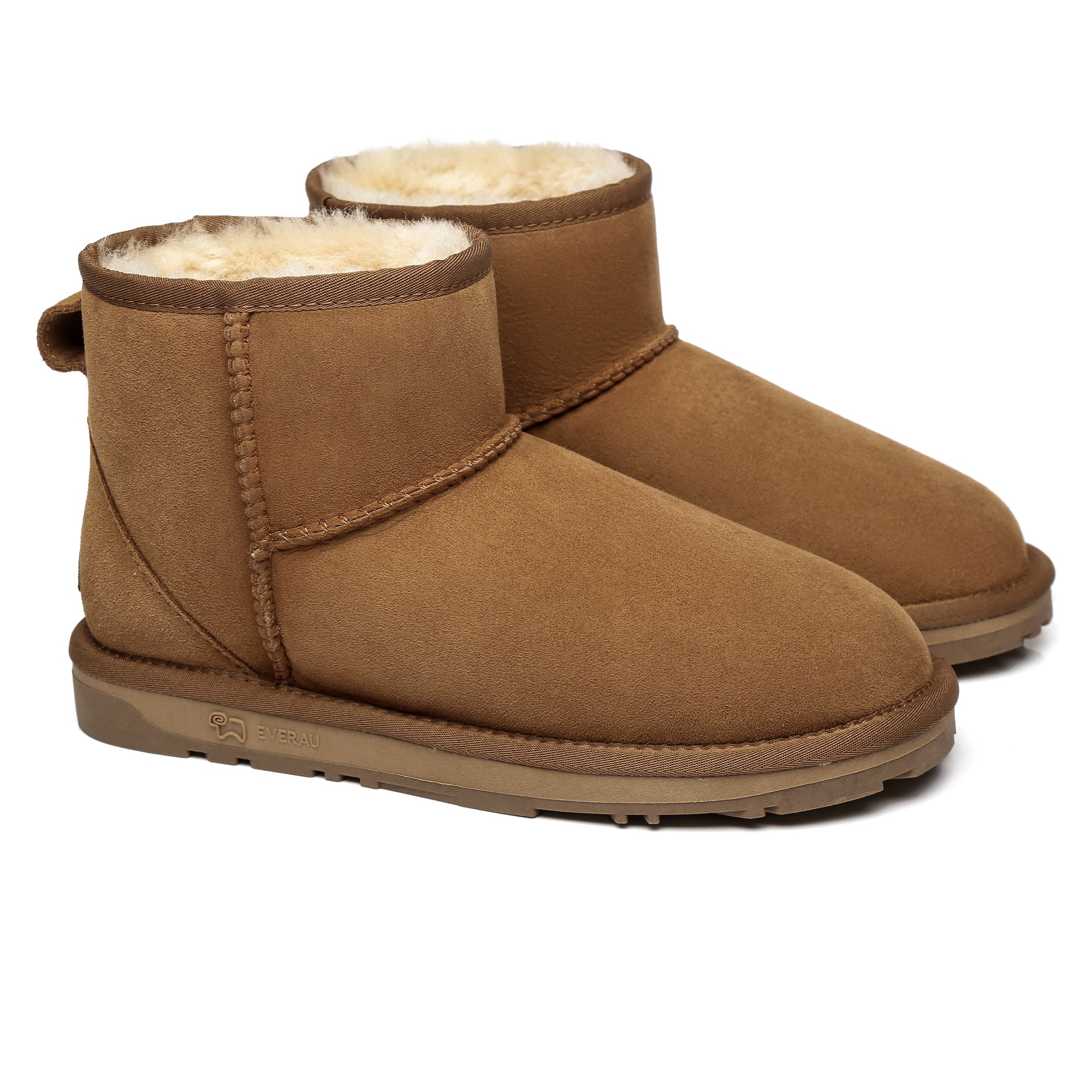 Close-up of beige Mini Classic Sheepskin UGG Boots for women by EverUgg, showing soft sheepskin and cozy design.